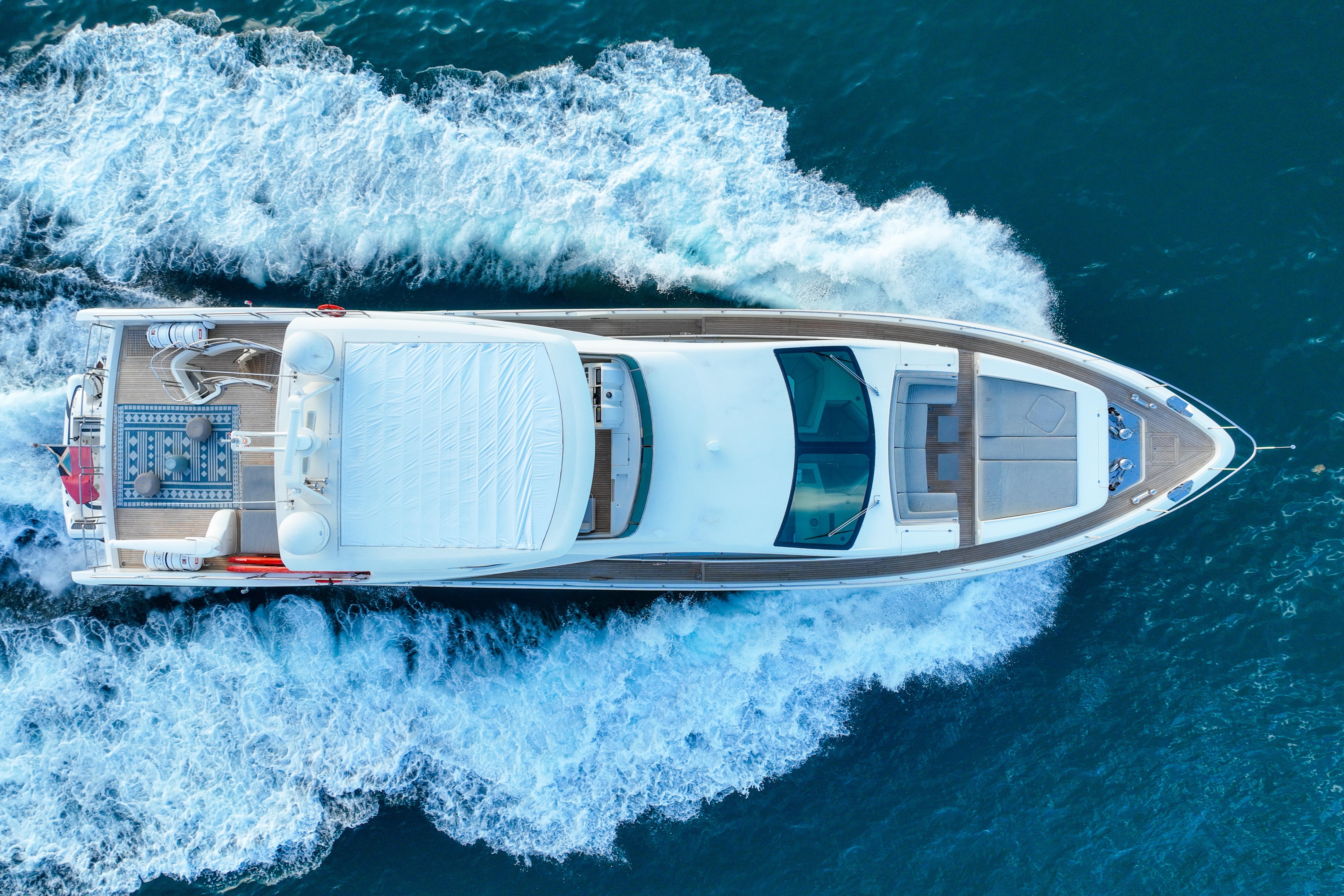 Aerial view of 2010 Azimut 95 yacht cruising on blue ocean waters.