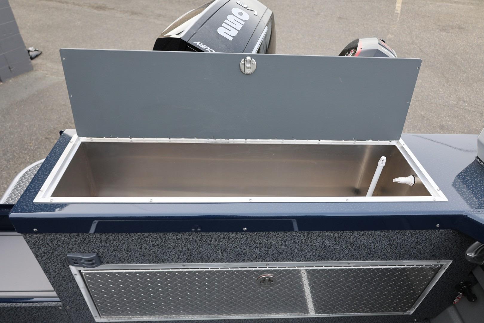 2026 Thunder Jet 24 Alexis Pro boat storage compartment with open lid and visible interior.