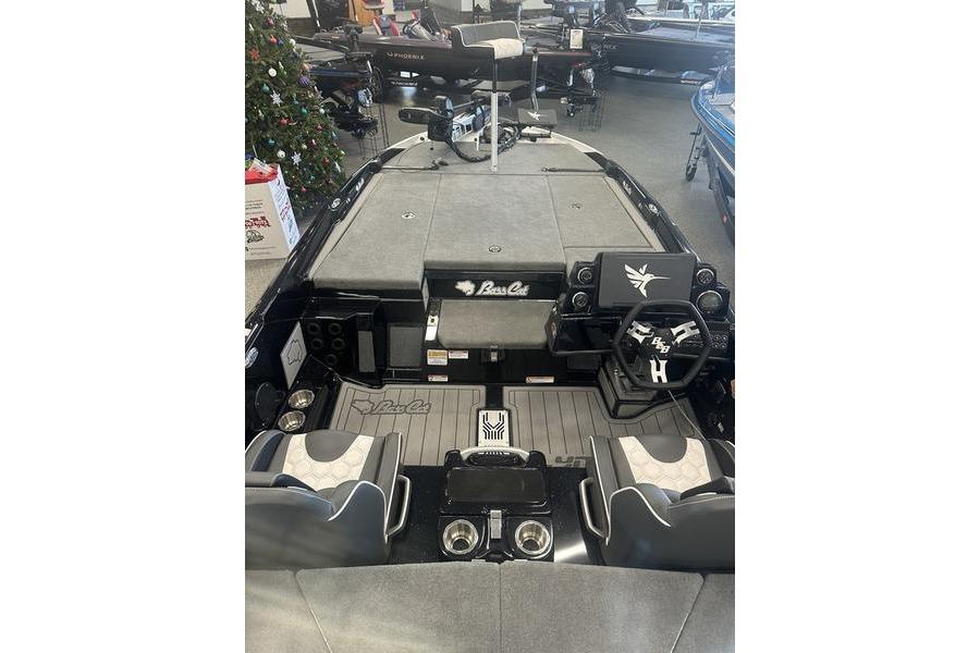 2026 Bass Cat Lynx STS boat interior with steering wheel and seating.