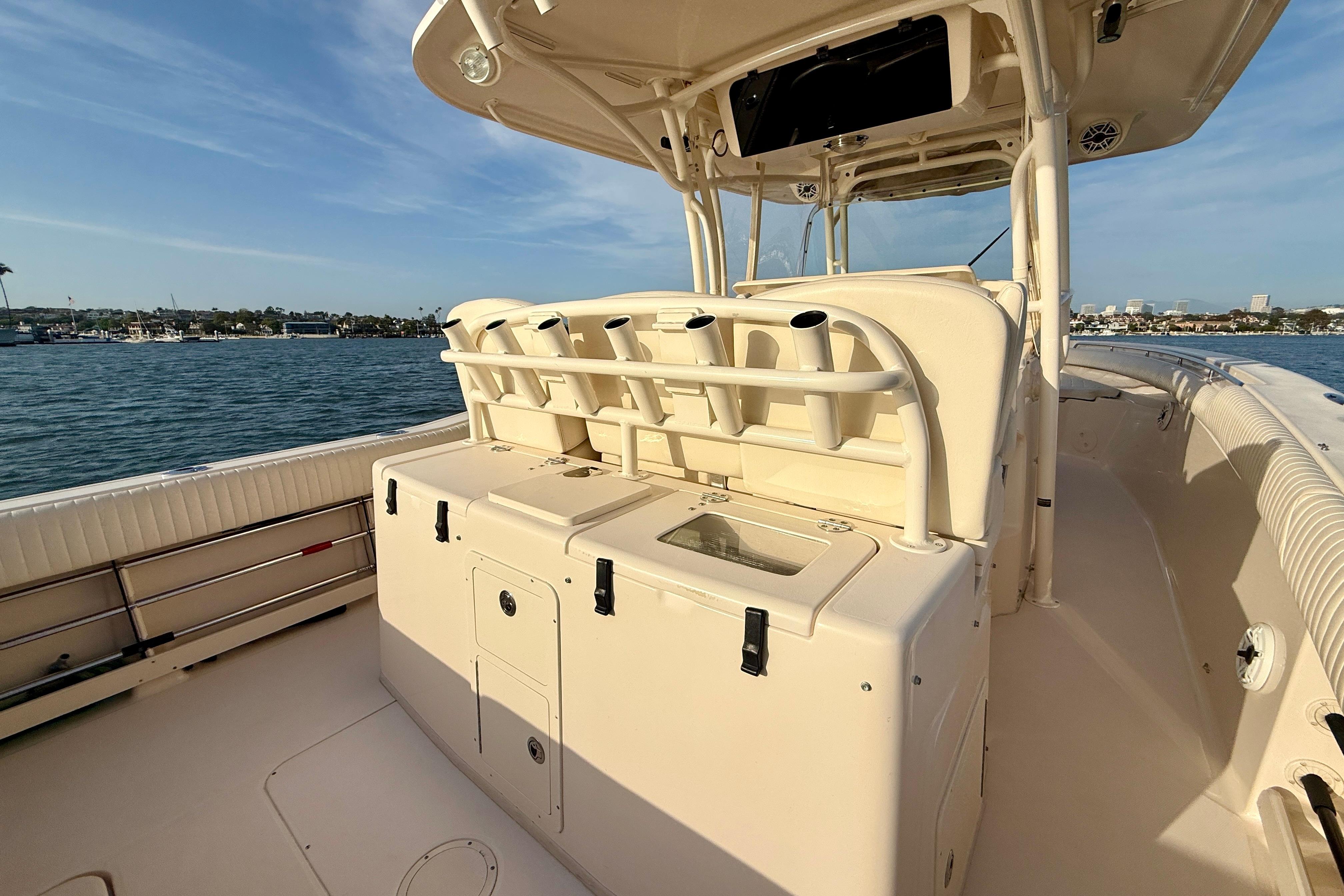 2012 Grady-White Canyon 336 boat interior with rod holders and storage, docked by the water.