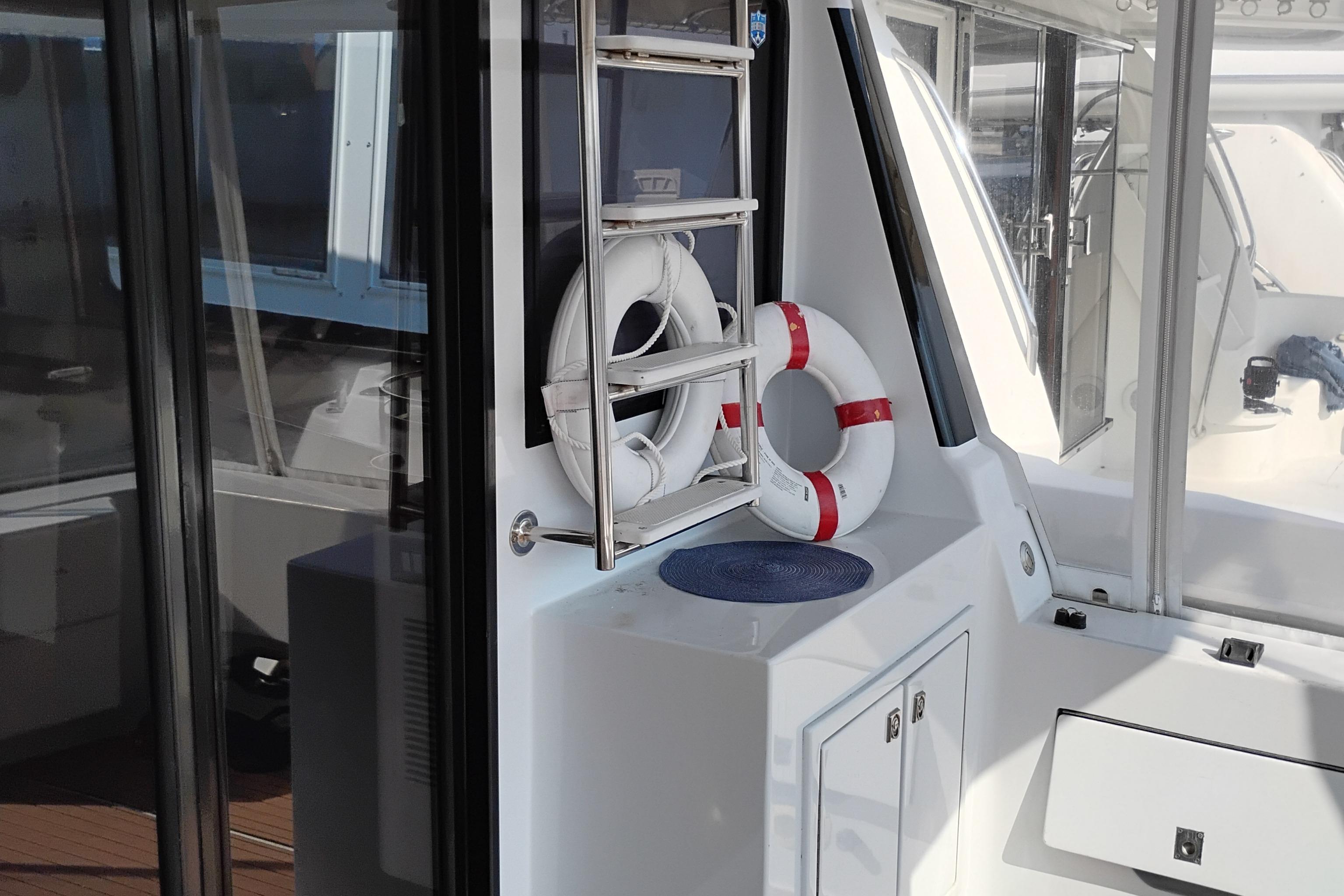 1995 Queenship 62 Pilothouse Motor Yacht interior with life rings and safety equipment.