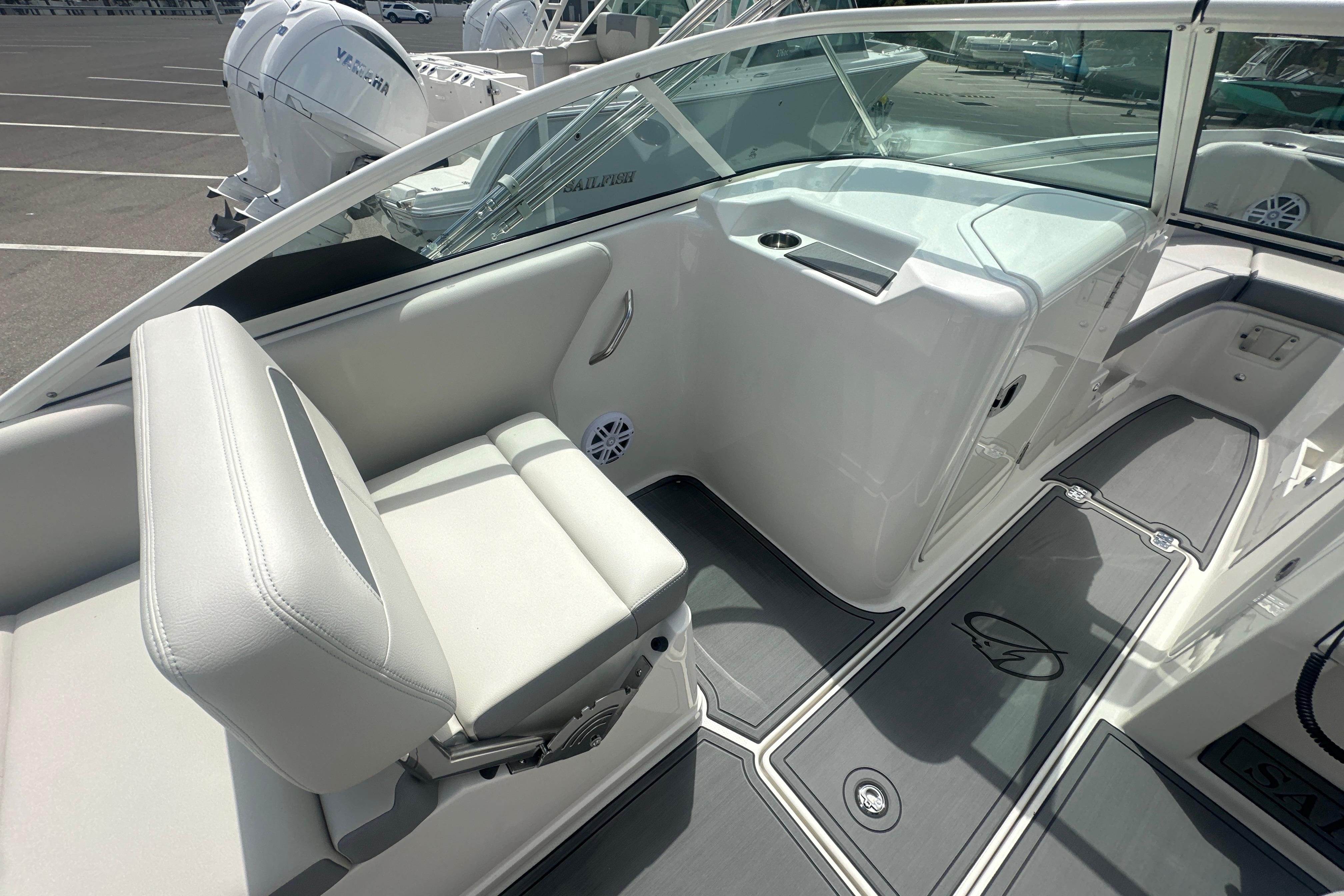 2026 Sailfish 226 DC boat interior with white seating and modern design.