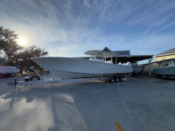 2025 Yellowfin 39 Offshore boat on trailer, parked outdoors under a clear sky.