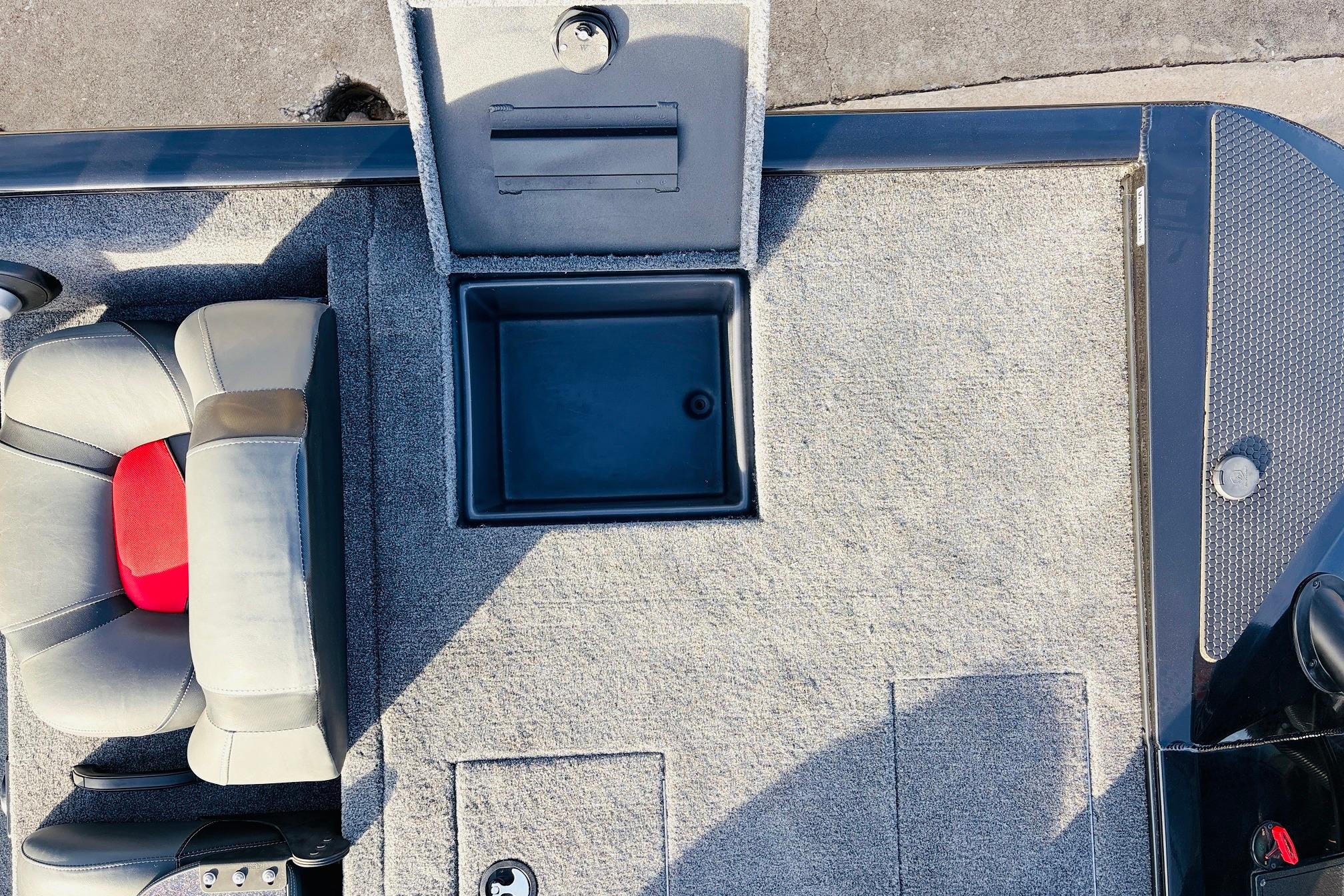 2025 Tracker Savage 215 boat interior with seating and storage compartment.