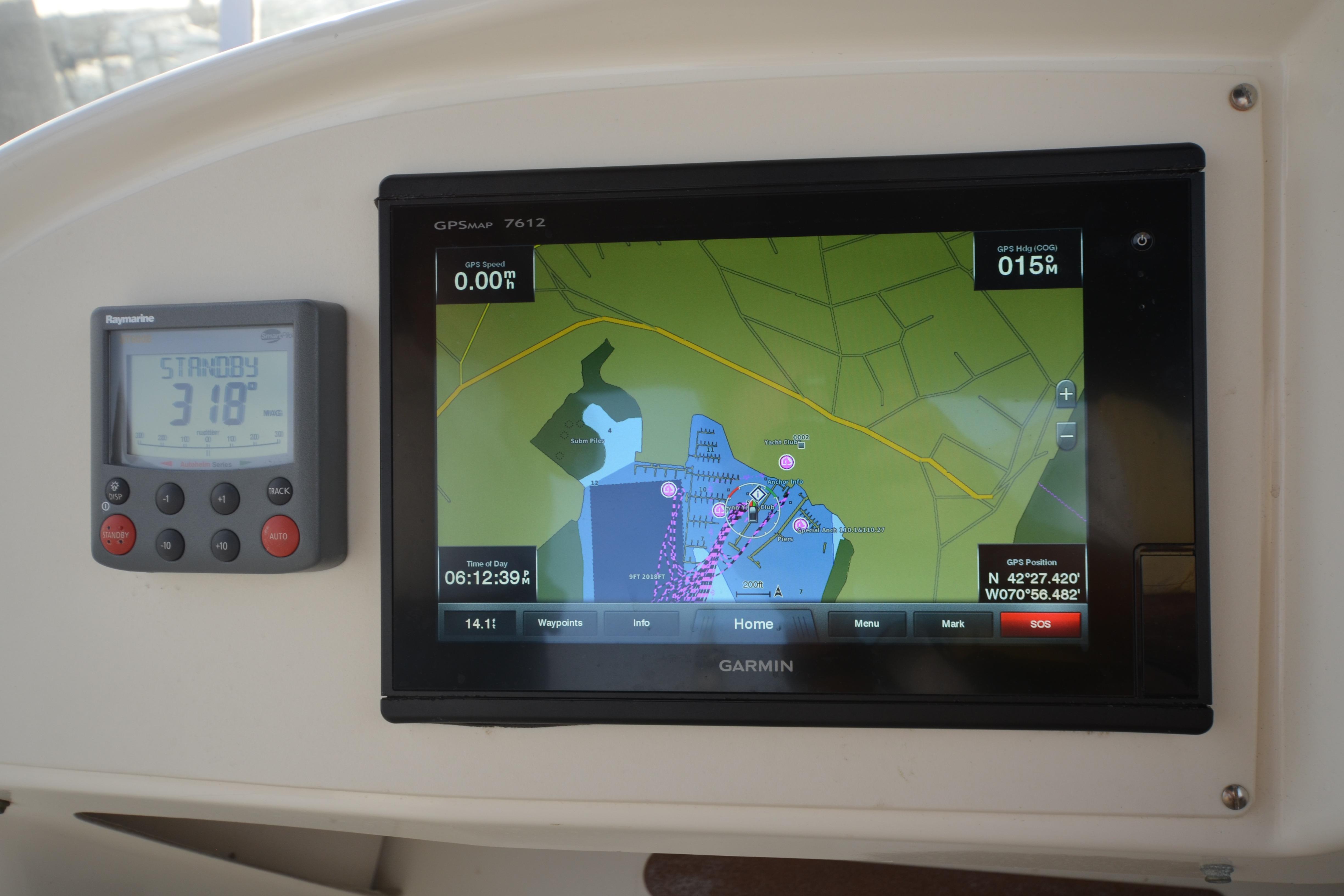 Garmin GPS and Raymarine display on 2007 Jeanneau Prestige 46 yacht dashboard.
