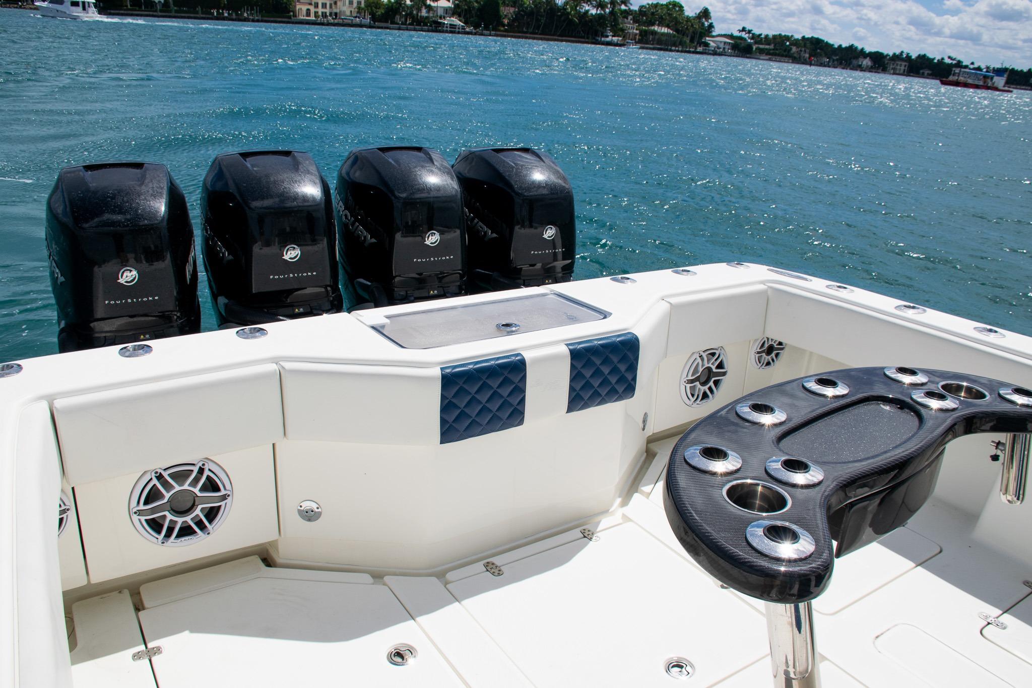 2022 SeaVee 390Z boat with four powerful outboard engines on a sunny day.