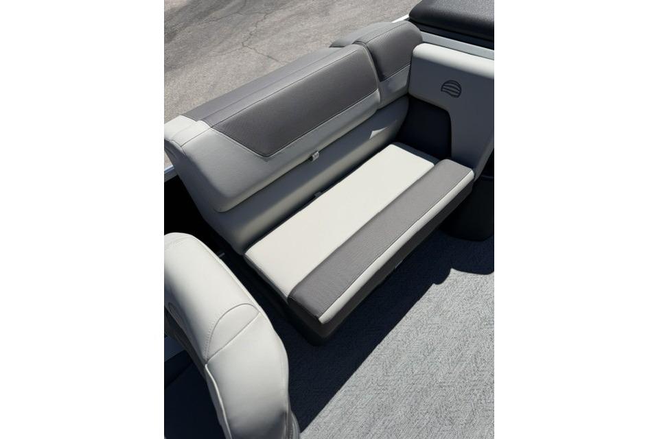 2026 Sun Tracker Fishin' Barge 20 DLX interior seating, featuring gray and white cushioned seats.