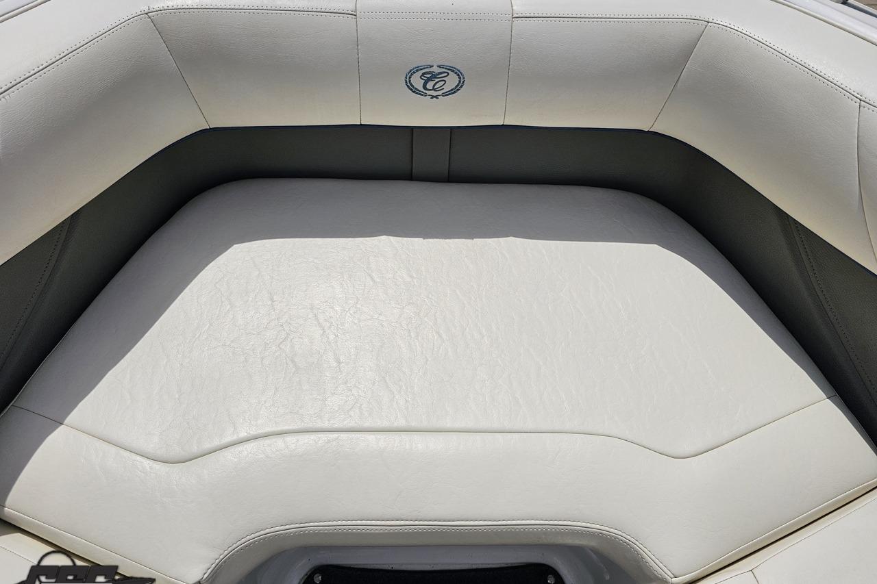 White leather seating on a 2010 Cobalt 232 WSS boat, featuring elegant stitching.