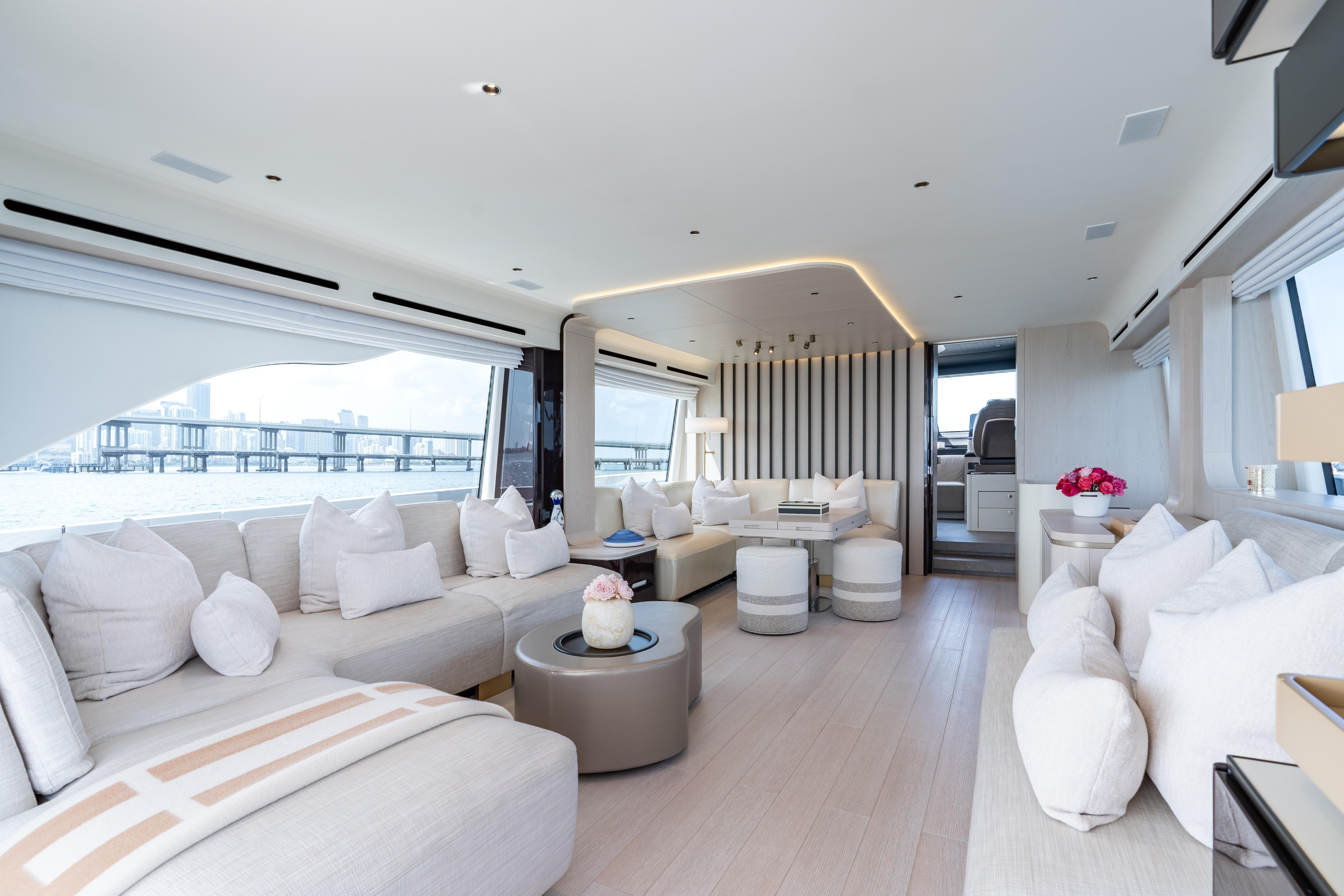 Luxurious interior of 2022 Azimut 78 yacht with elegant seating and panoramic windows.