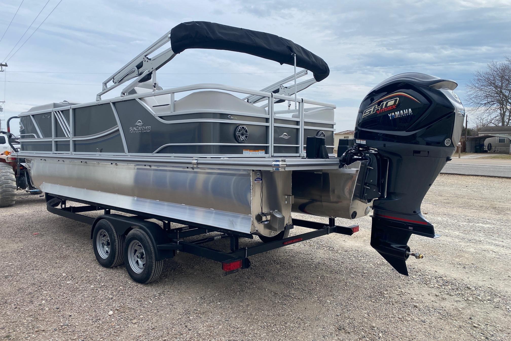 2026 SunCatcher Diamond Elite 324 SS pontoon boat with Yamaha motor on trailer.