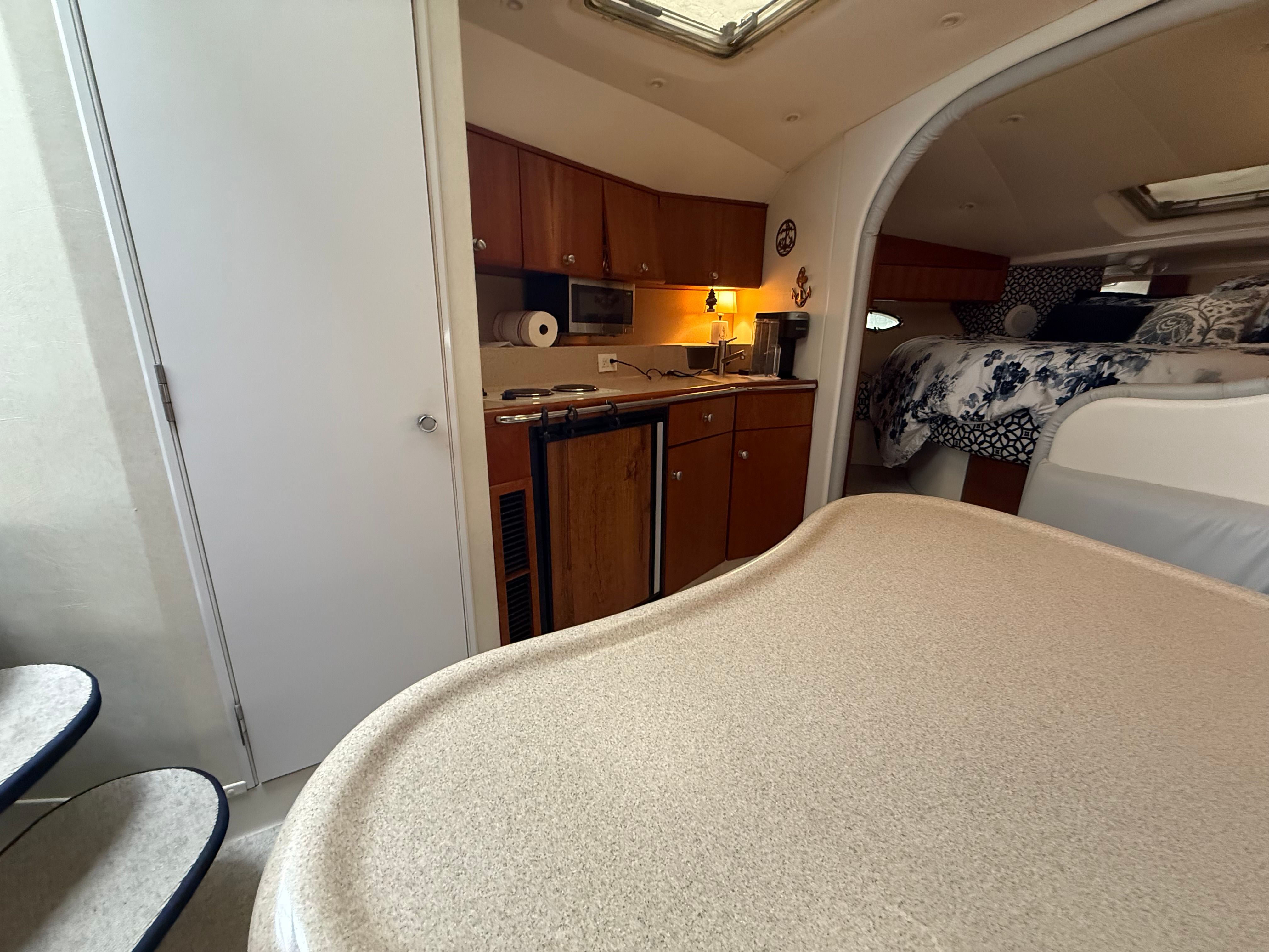 Interior of the 1995 Silverton 360 featuring a kitchen and sleeping area.