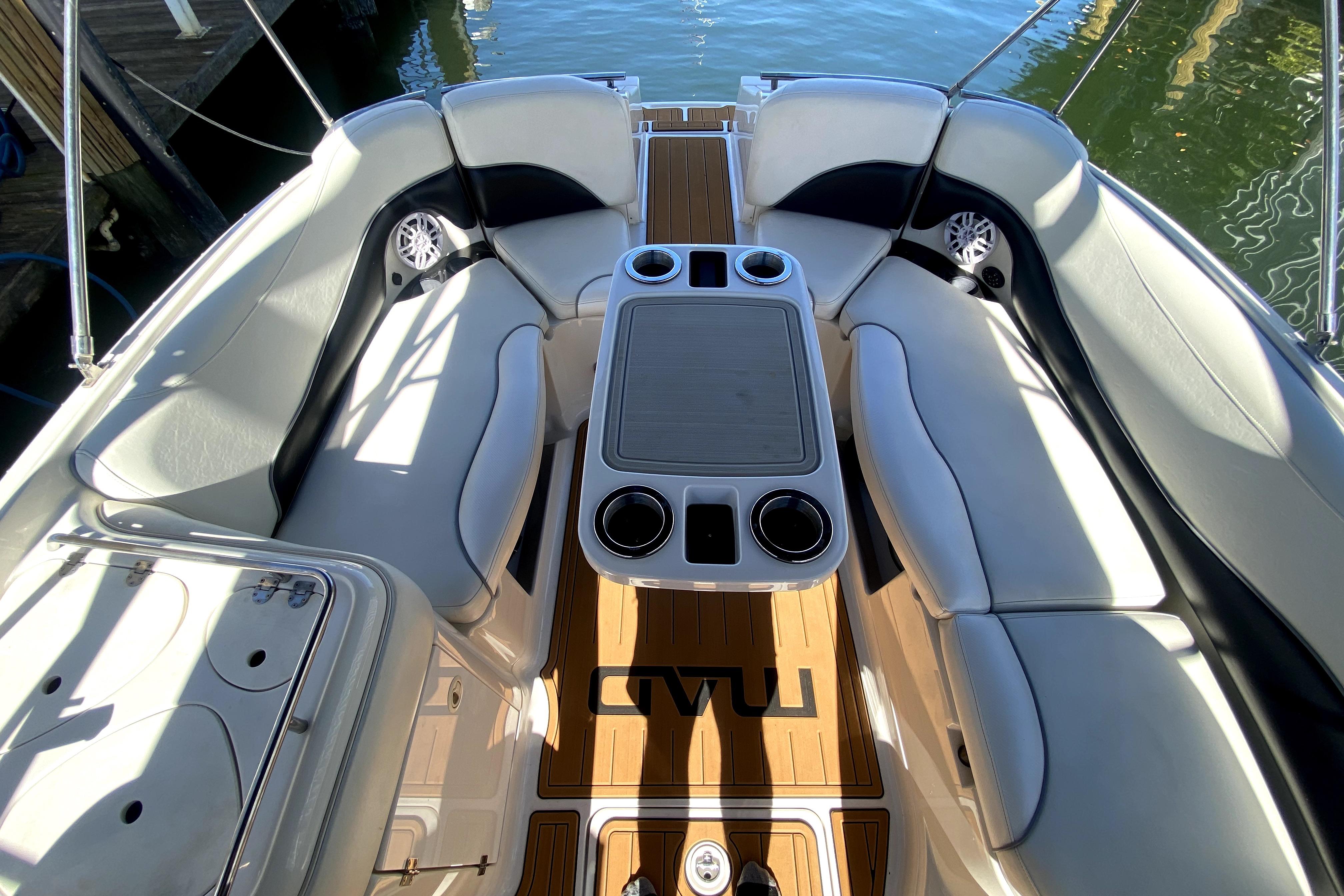 Interior of 2006 Monterey 263 Explorer Sport boat with seating and table.