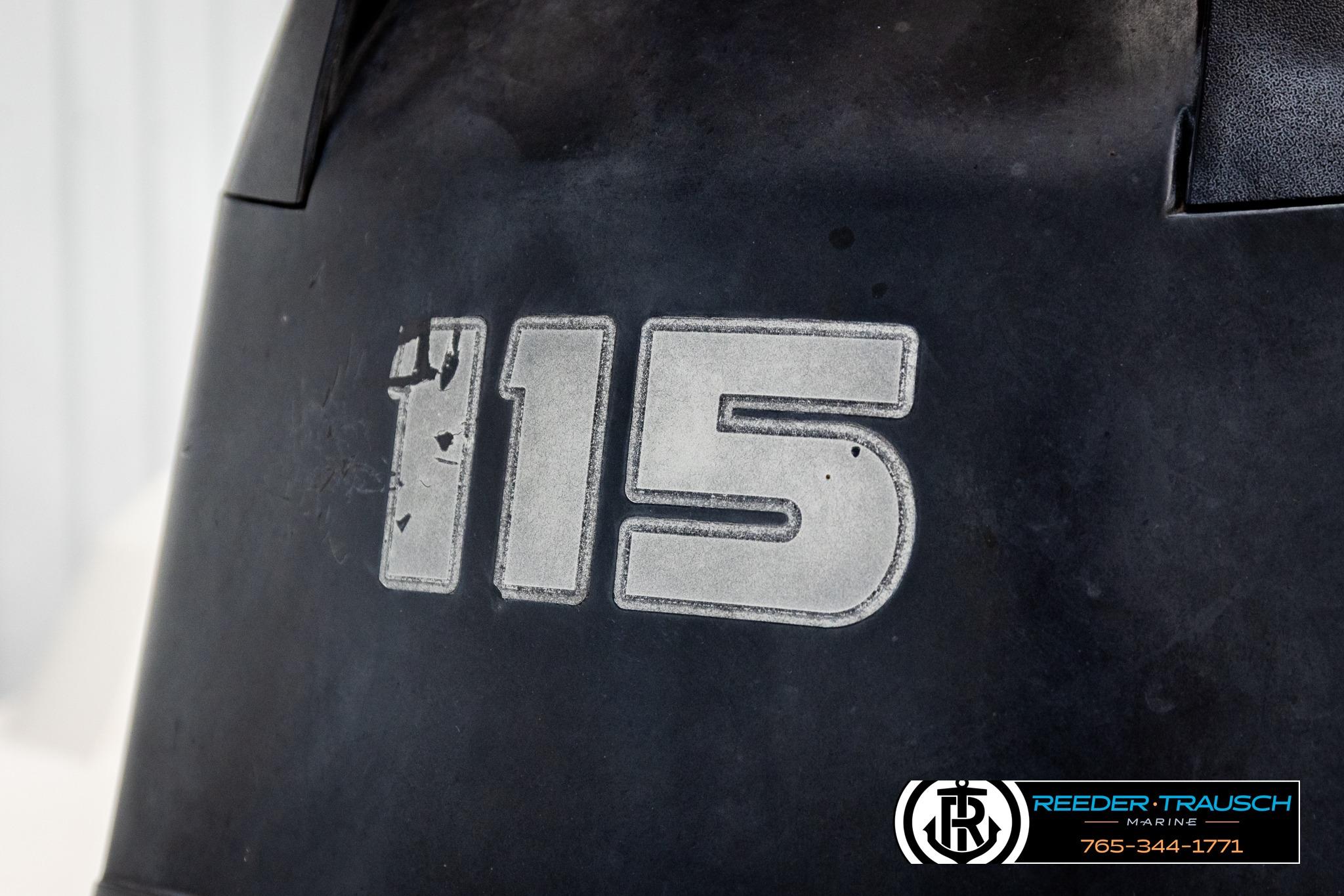 Close-up of a Tahoe 450 TS 2016 boat engine with "115" marking.
