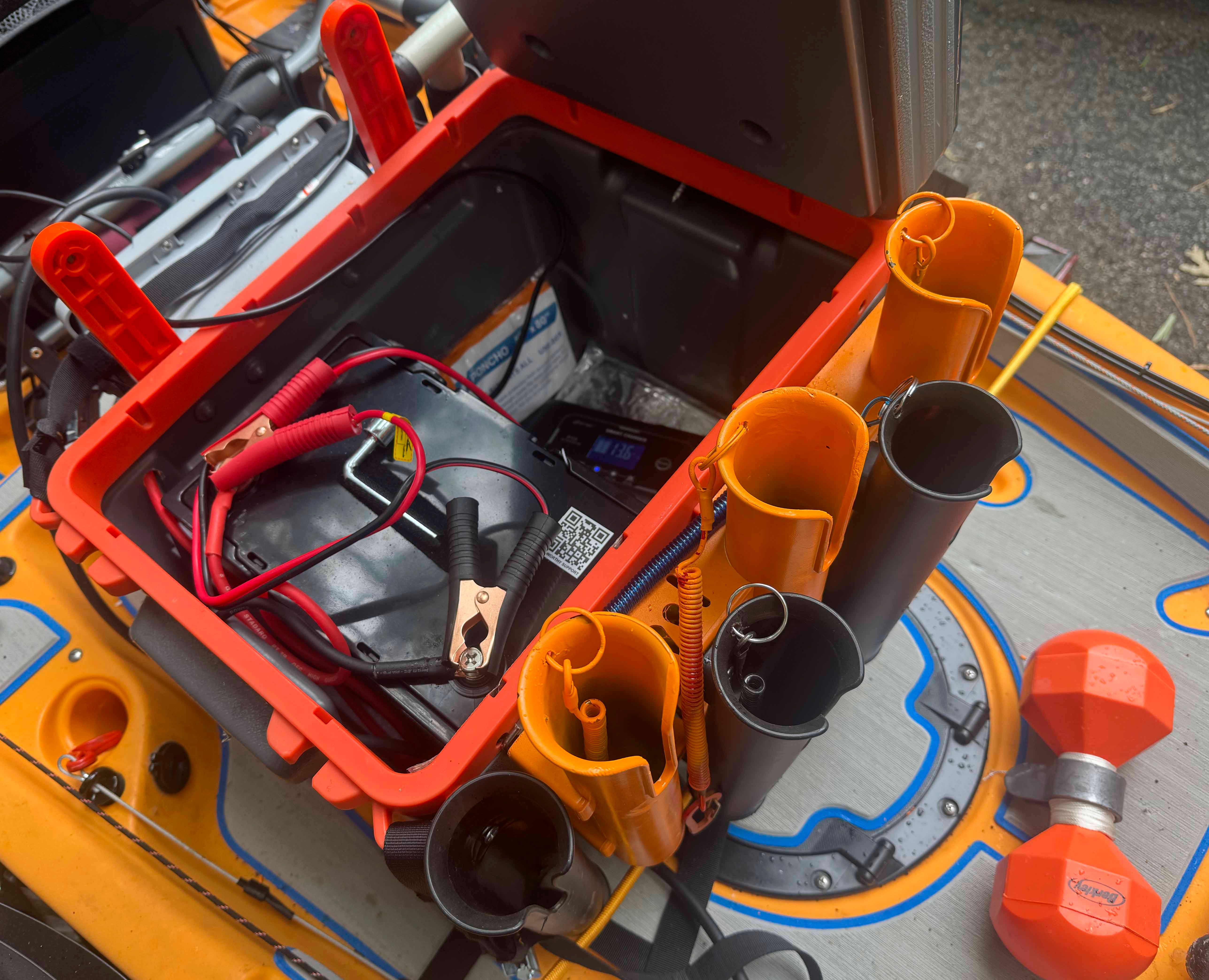 A Hobie 14 Pro Angler Kayak with fishing rod holders and battery cables.