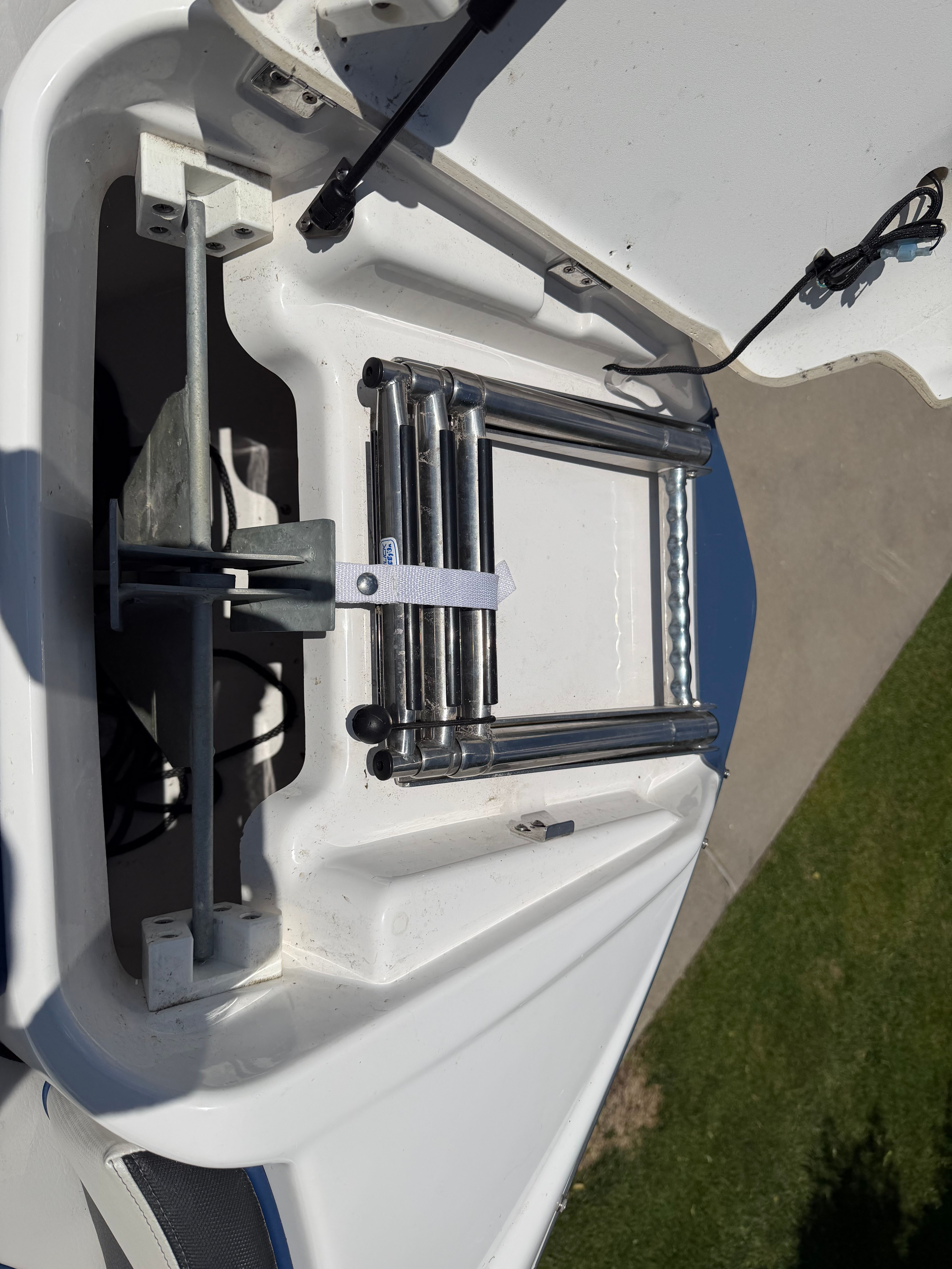 A folded swim ladder on a boat.