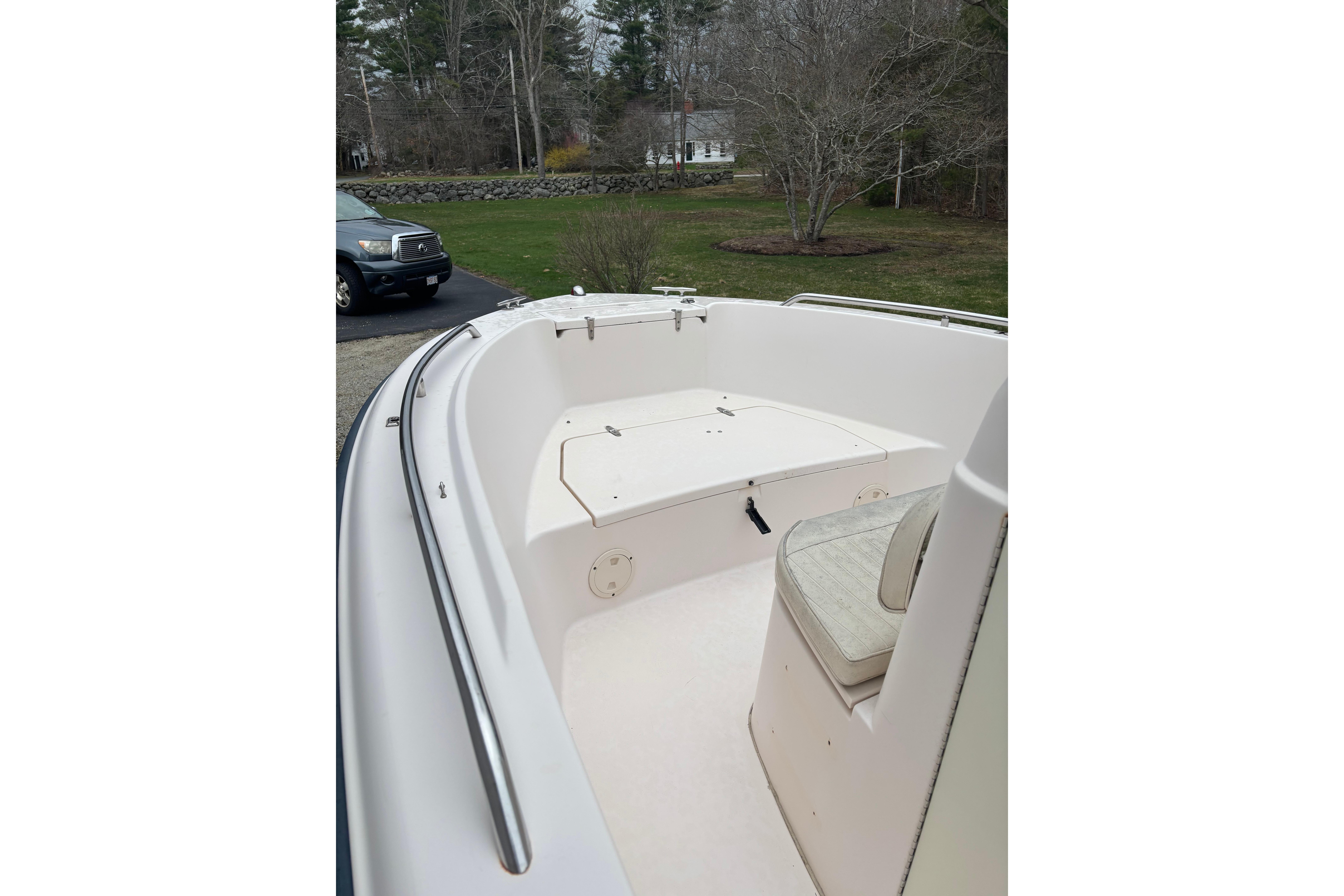 2001 Grady-White Fisherman 180 boat interior with seating and storage, parked outdoors.