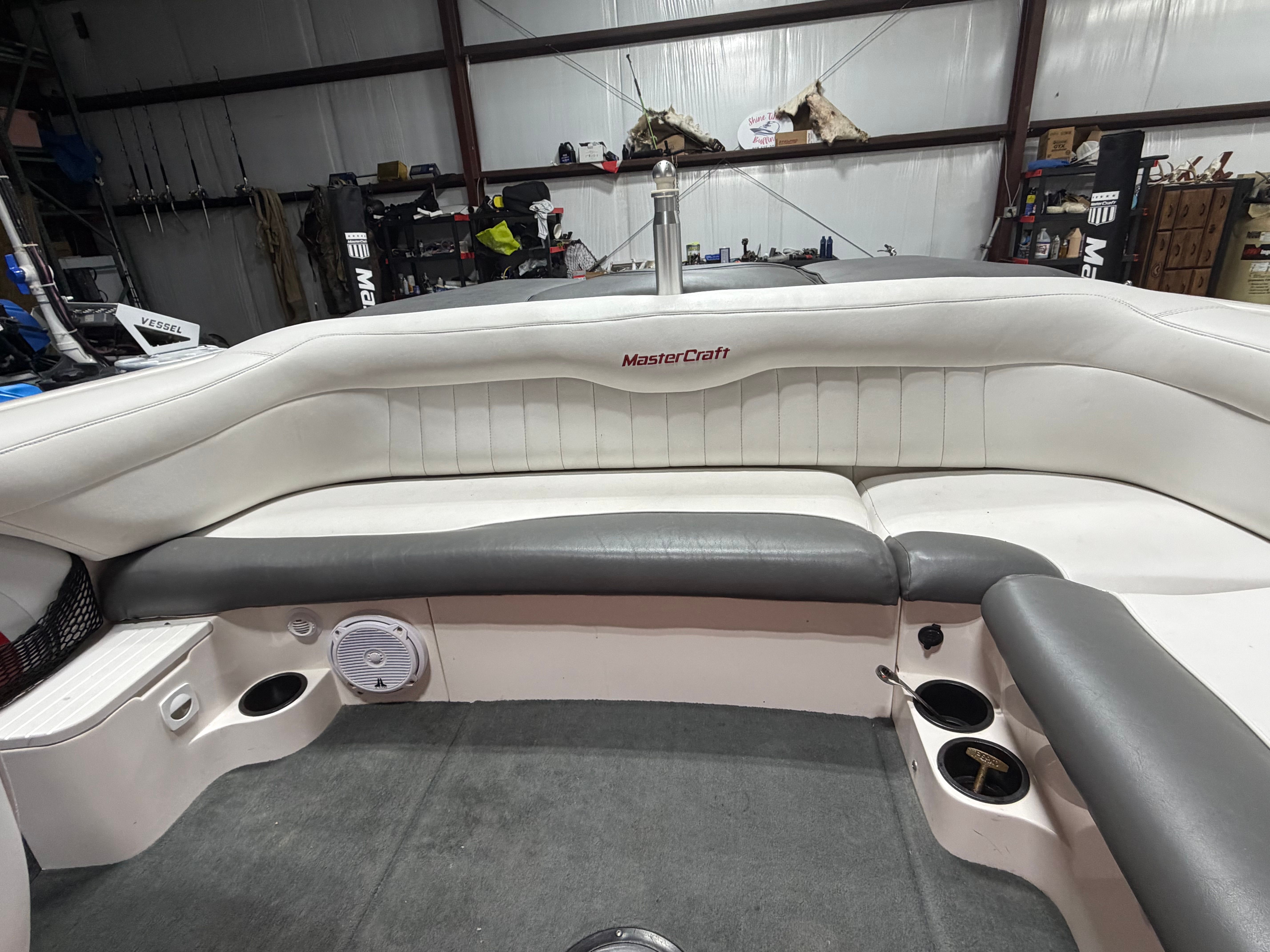 Interior of a 2004 MasterCraft X2 boat with gray and white seating.