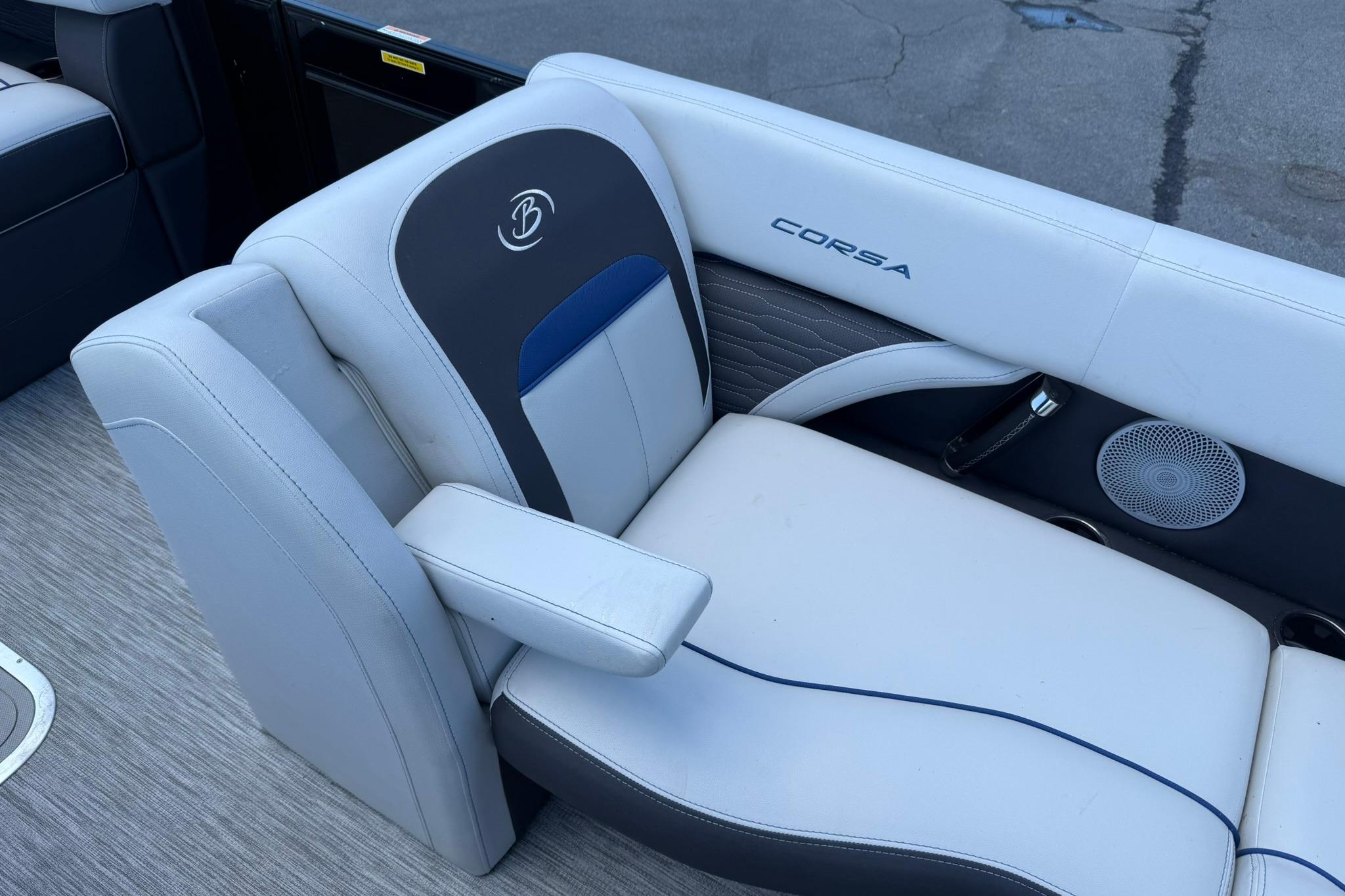 2023 Barletta Corsa 23U boat seat with logo and speaker detail.