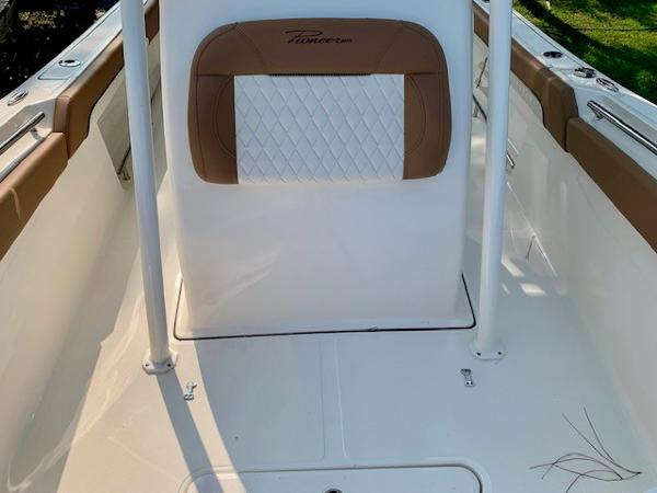 2025 Pioneer 222 Islander boat interior with tan and white seating.