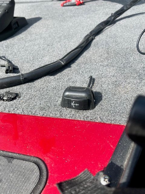 Close-up of a switch on a 2022 Bass Tracker Classic XL boat.