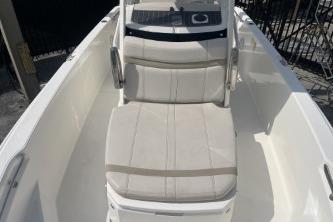 2024 Boston Whaler 220 Dauntless boat interior with cushioned seating.