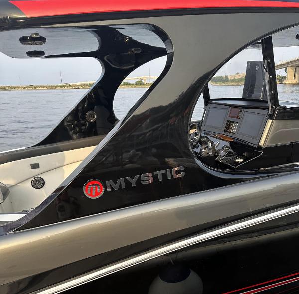 2017 Mystic Powerboats M4200 cockpit and dashboard view on the water.