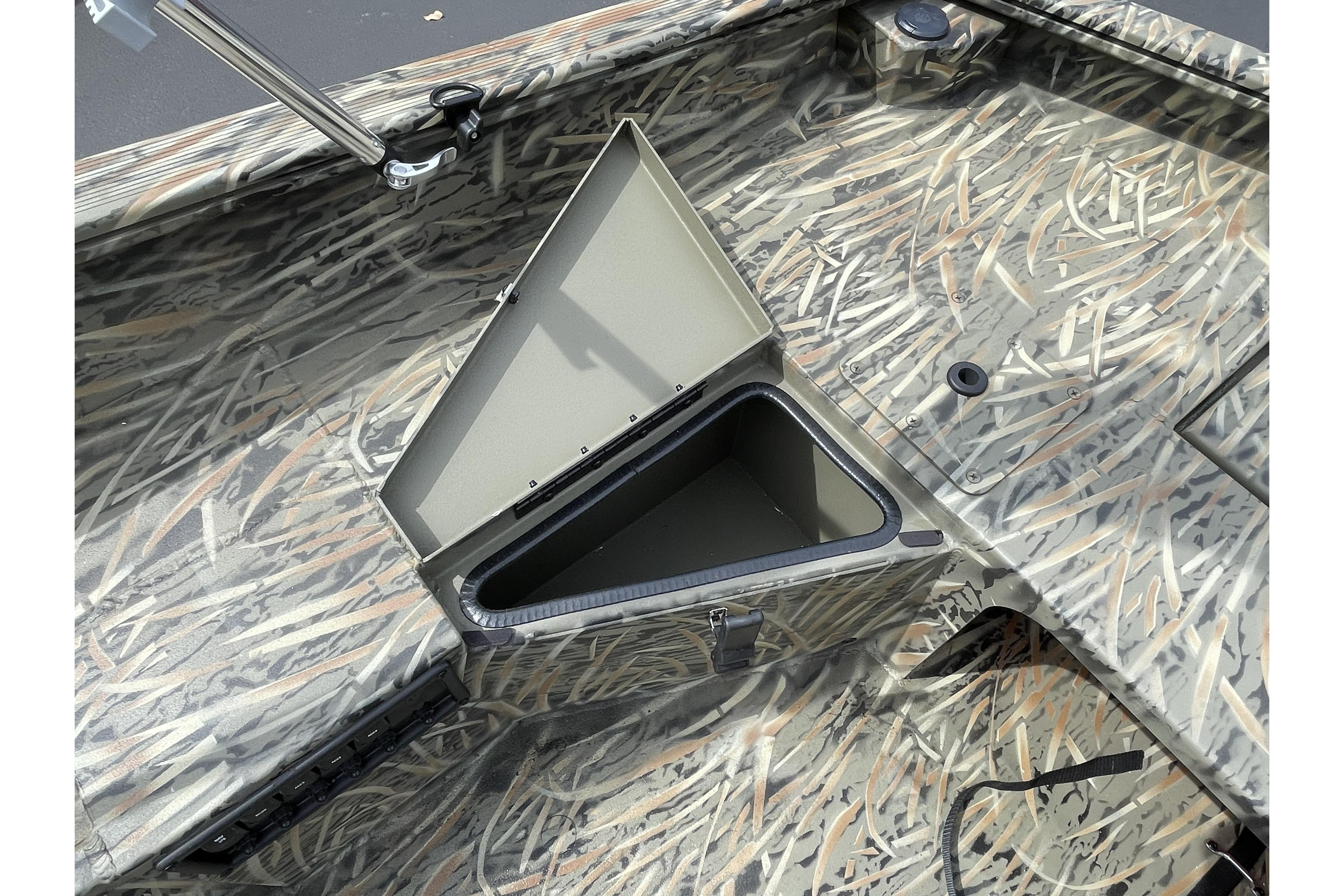 2026 Tracker Grizzly 1756 T Marsh boat with open storage compartment, camo design.