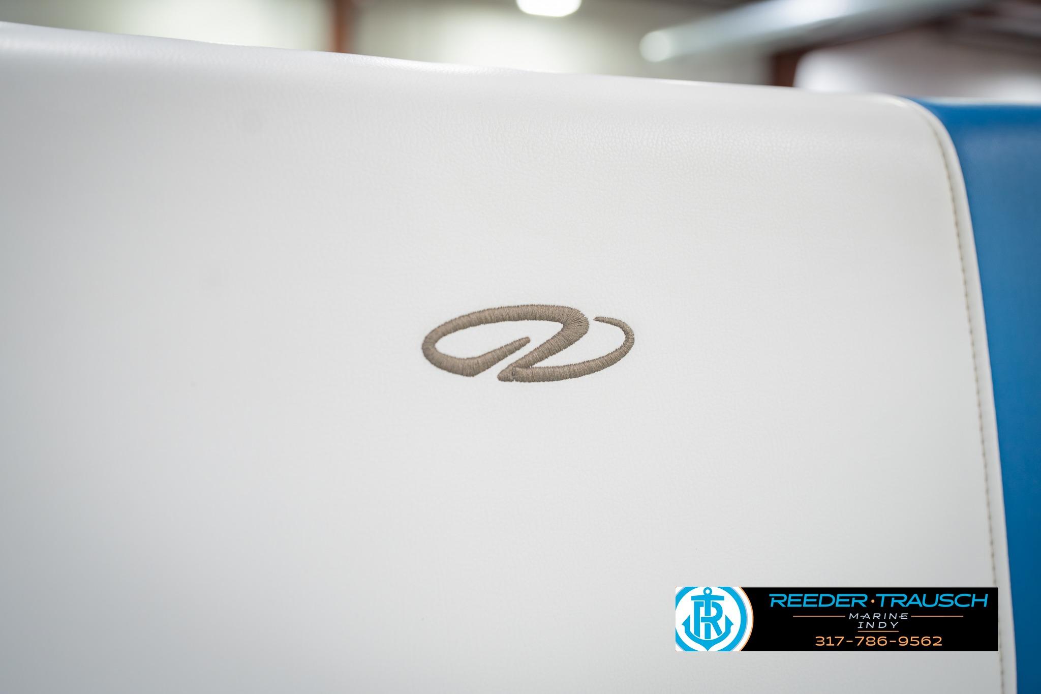 White seat with embroidered logo on a 2015 Regal 2000 ESX Bowrider boat.