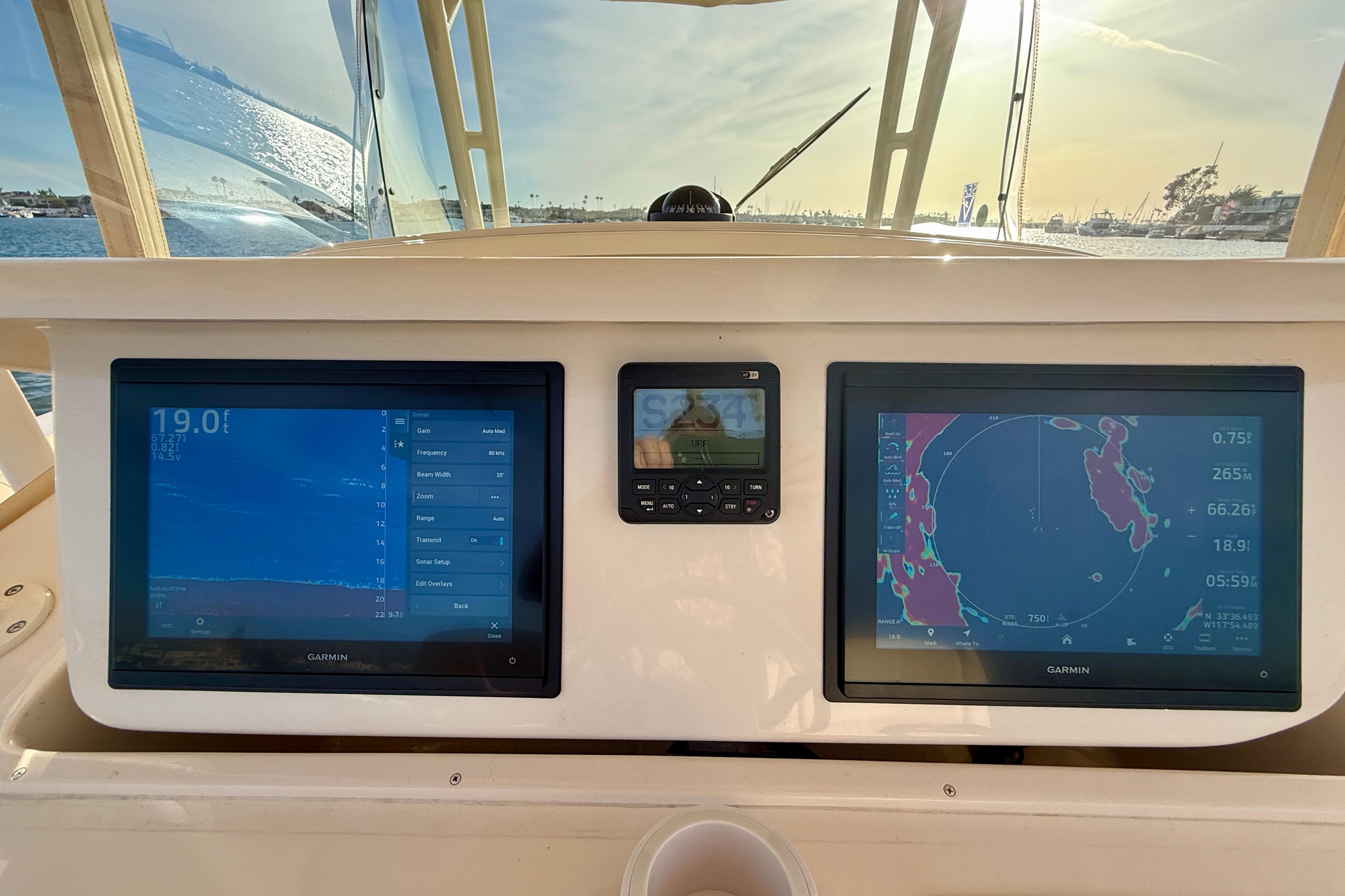 Grady-White Canyon 336 boat dashboard with Garmin navigation screens, 2012 model.