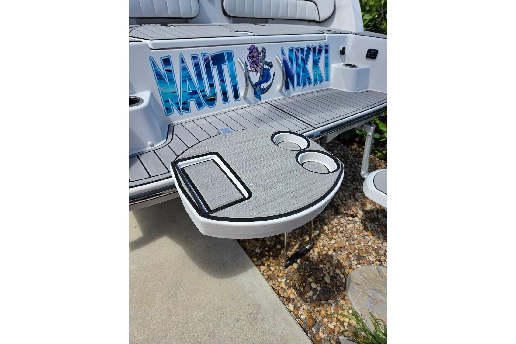 2024 Yamaha Boats 222 FSH Sport E with custom deck and table setup.