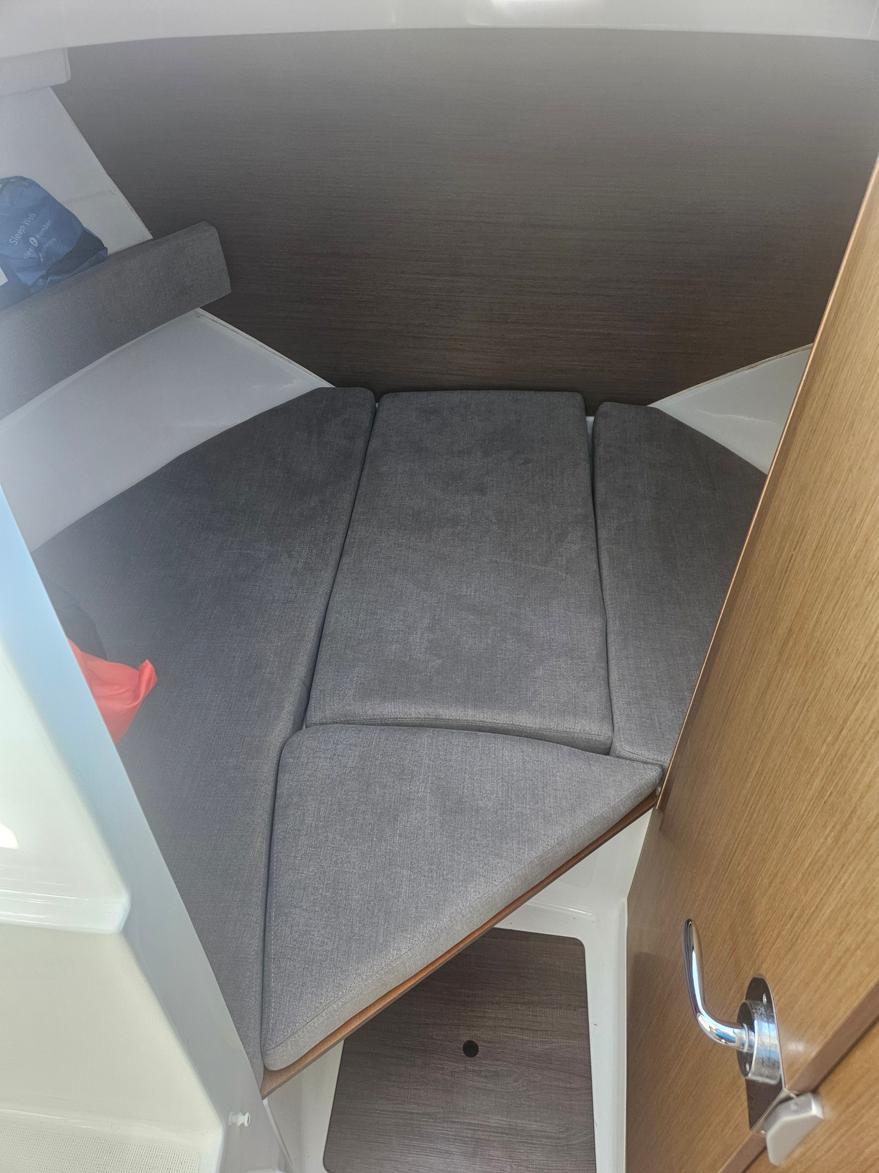 Interior of 2021 Beneteau Antares 8 with gray upholstery.