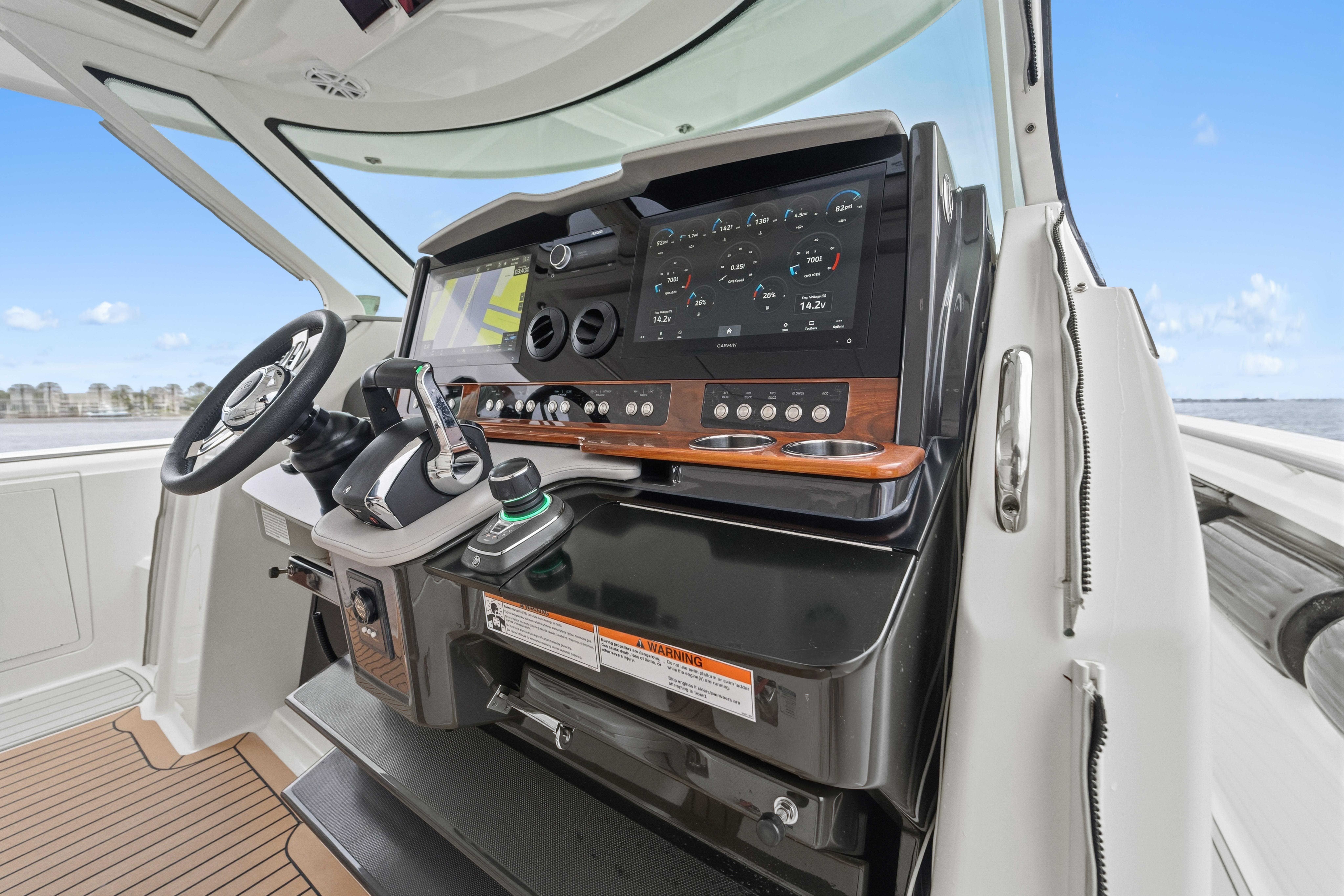 2022 Tiara Sport 43 LS helm with advanced navigation controls and sleek design.