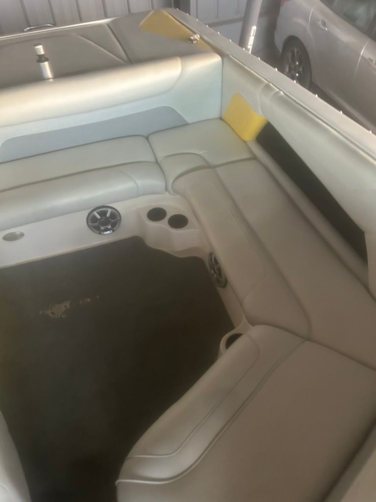 Interior of a 2003 Centurion Avalanche boat with seating area.