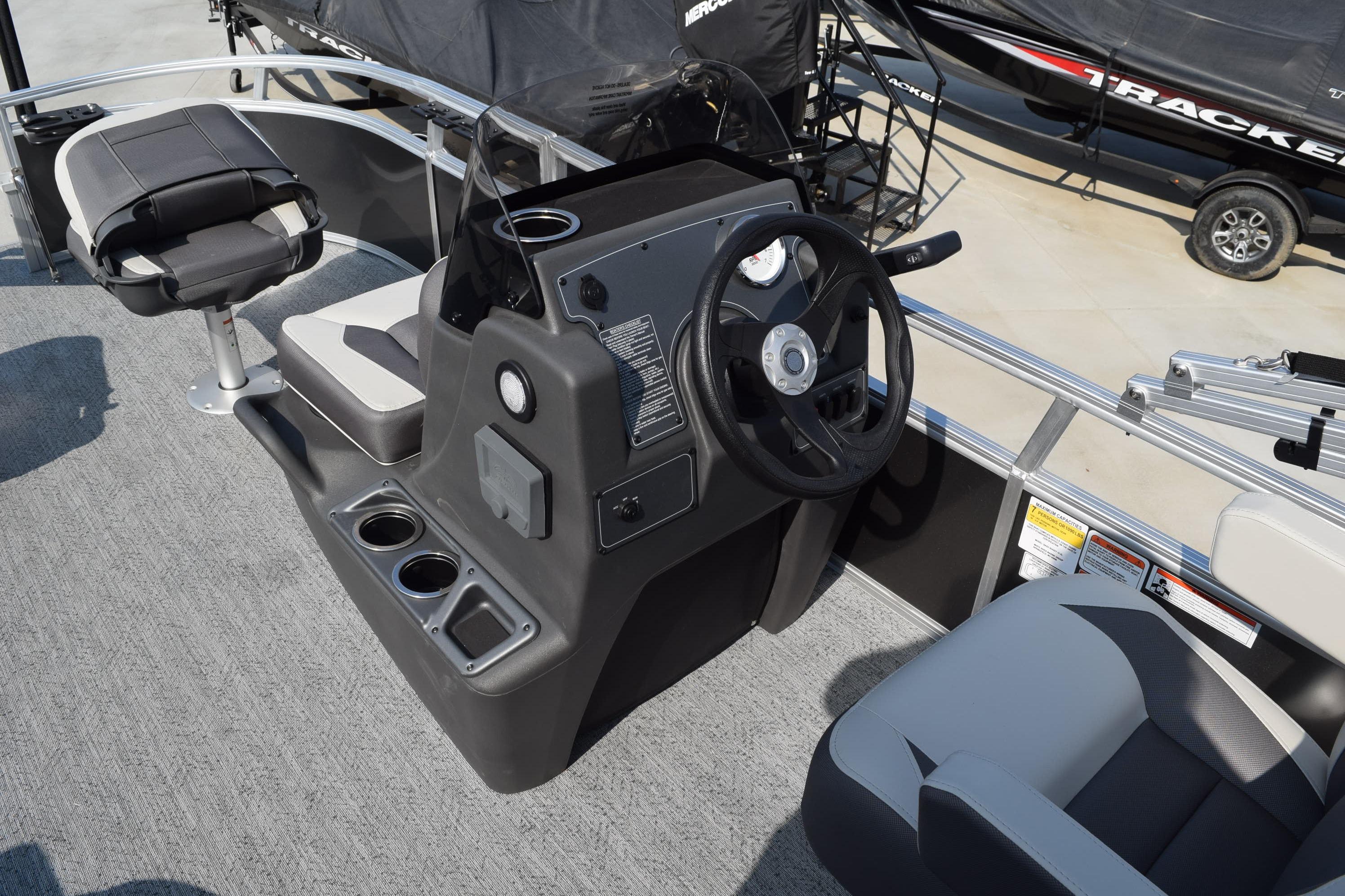 2026 Sun Tracker Bass Buggy 16 XL Select boat interior with steering console and seating.