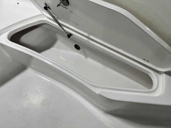 Storage compartment in Tidewater 232 CC Adventure boat, 2023 model.
