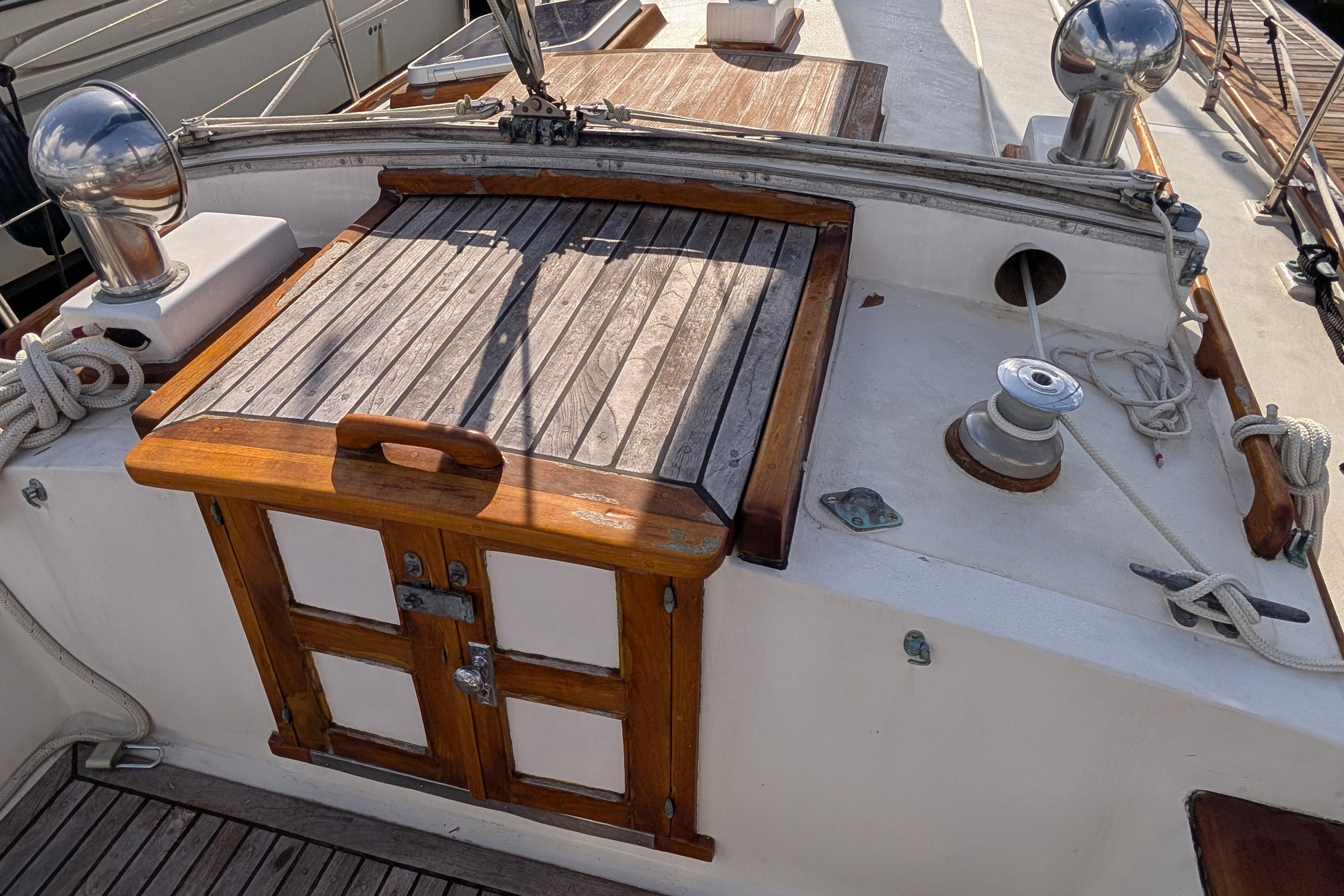 1983 Robert Perry 41 sailboat deck with wooden hatch and winch.