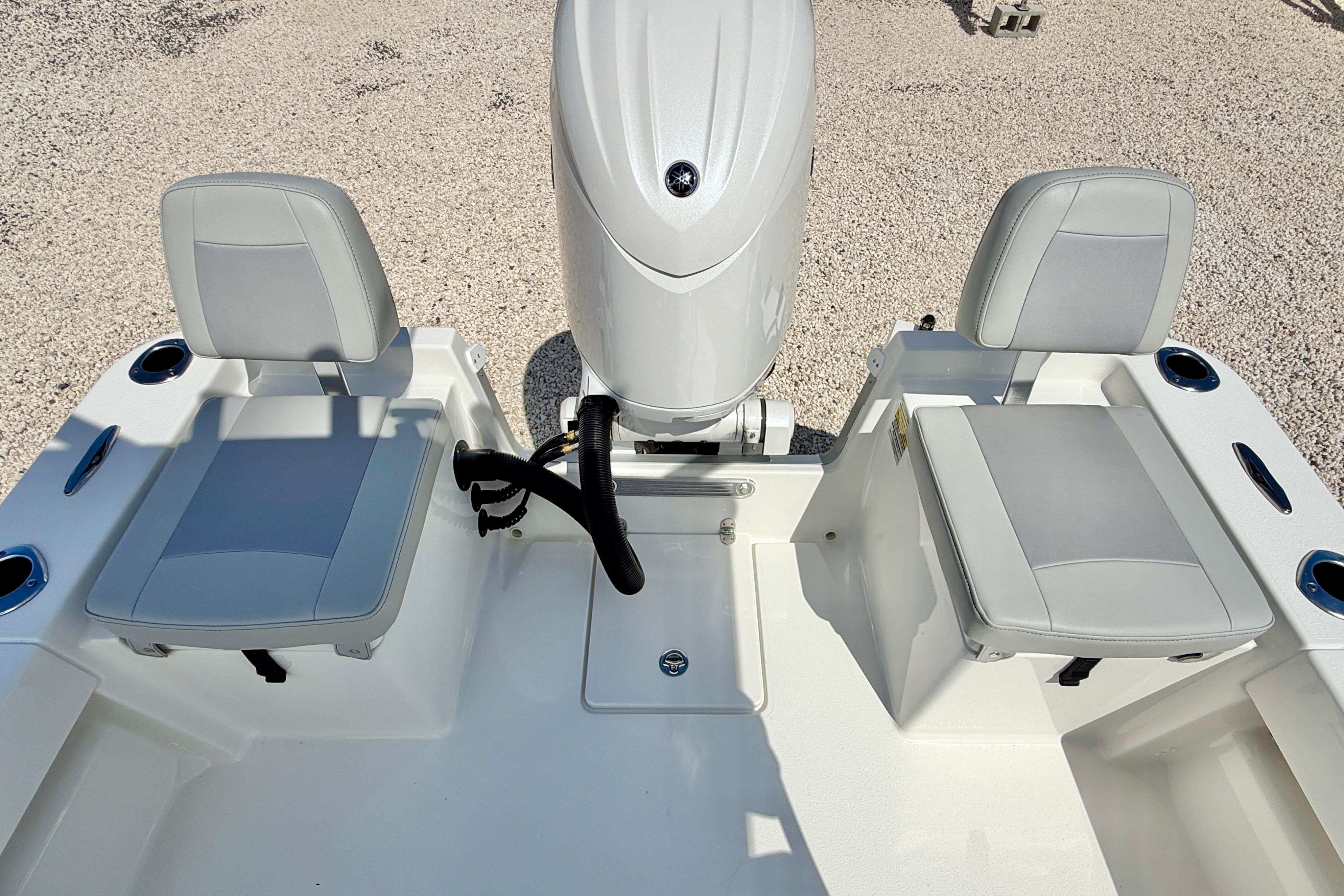 2026 Bay Rider 219 Bay boat interior with dual seats and motor.