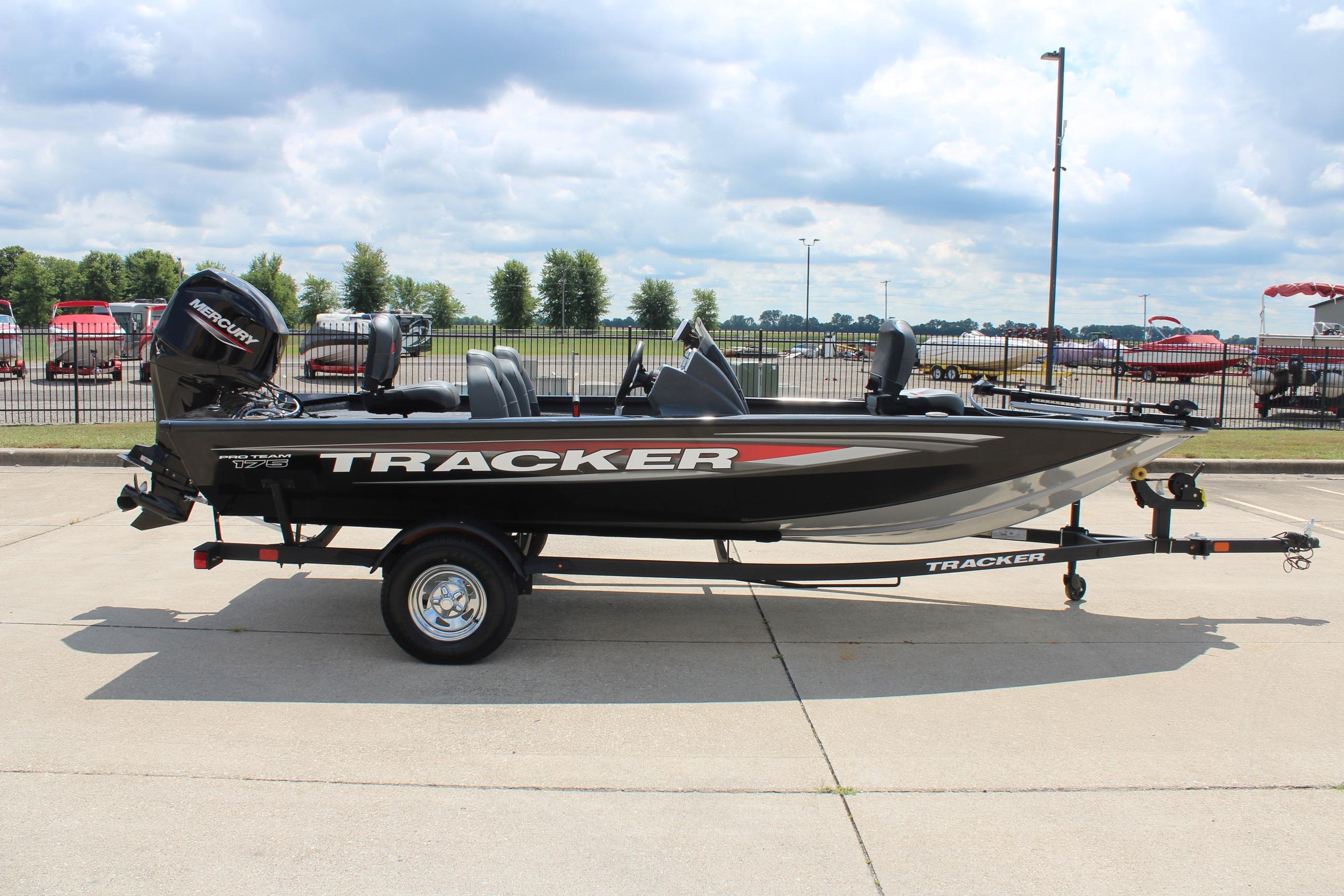 2026 Tracker Pro Team 175 boat on trailer, parked outdoors under cloudy sky.