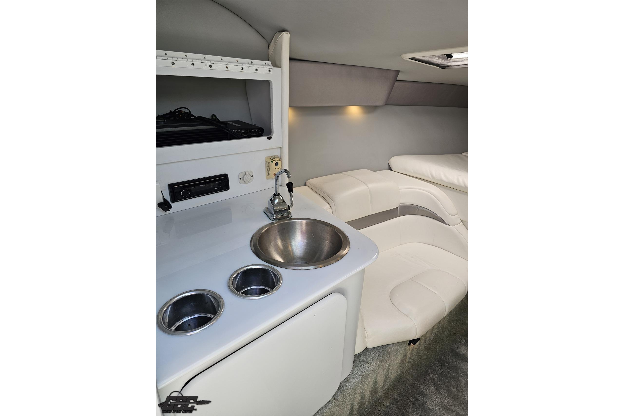 Interior of 2005 Formula 271 FASTech boat with sink and seating area.