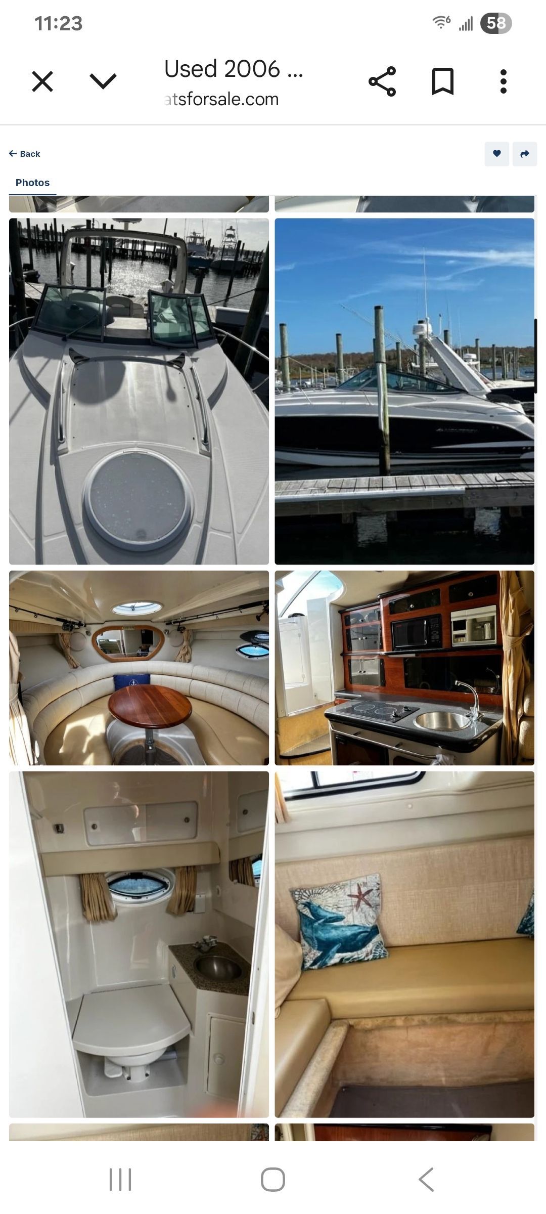 Interior view of a 2006 Monterey 290 Cruiser with kitchen and seating area.