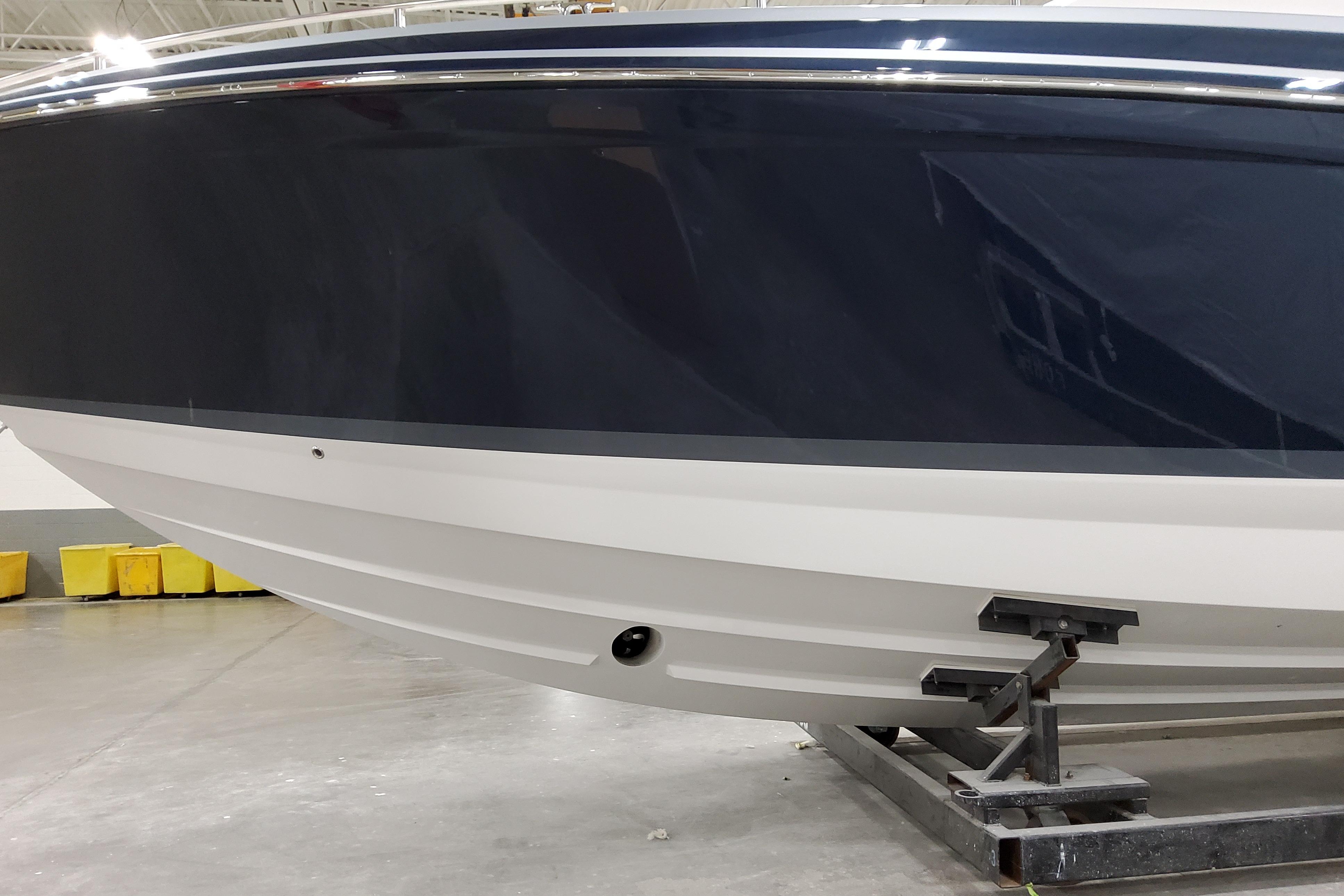 2026 Formula 400 Super Sport Crossover boat hull in a showroom setting.