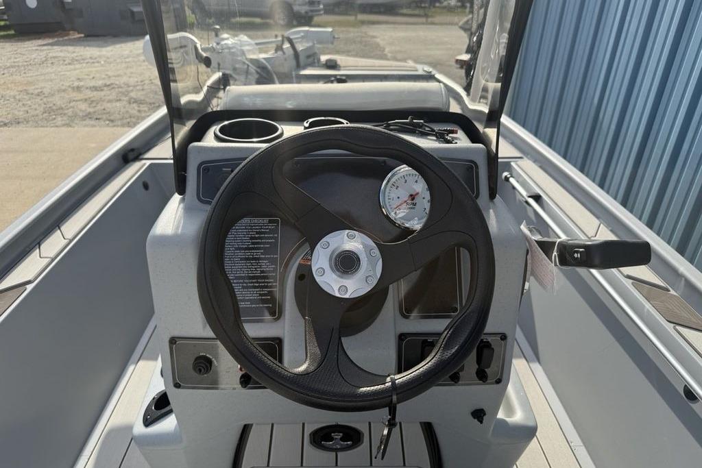 2026 Tracker Bass Tracker Classic CC boat console with steering wheel and gauges.