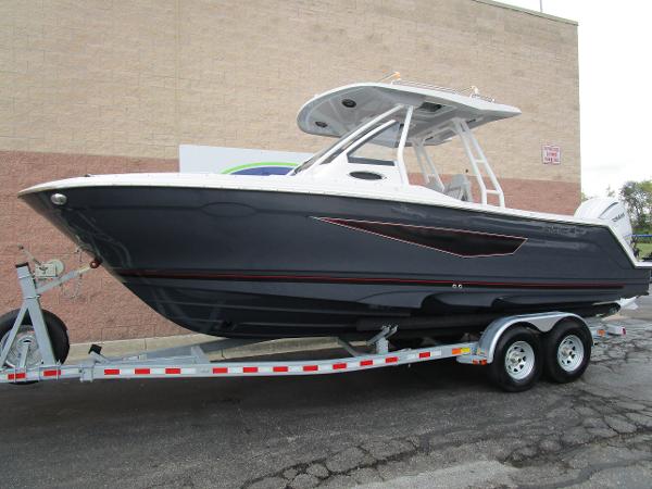 2025 Solara S-250 CW boat on trailer, sleek design, parked outdoors.