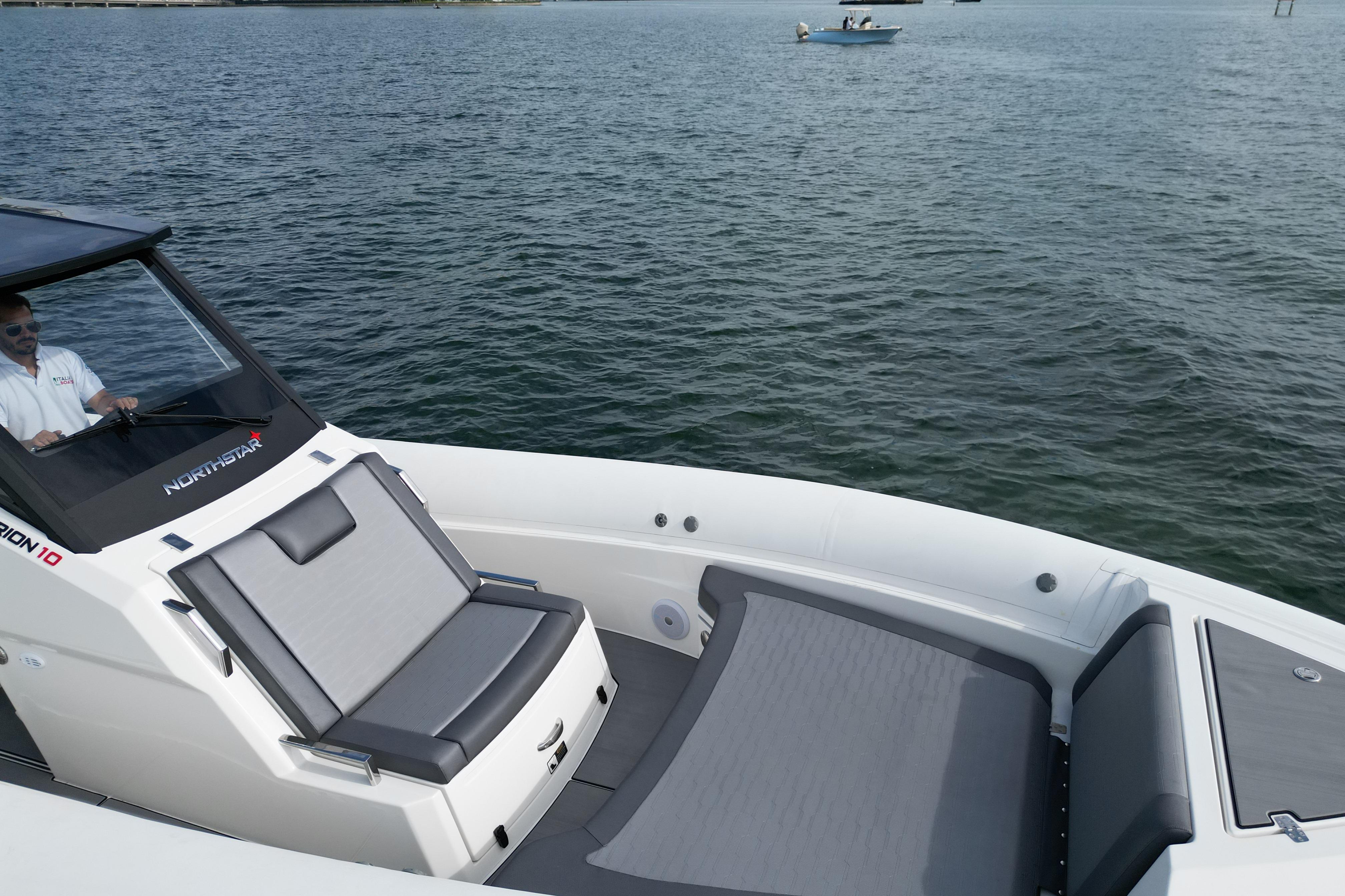 2026 Northstar ORION 10 boat on water, featuring sleek design and comfortable seating.