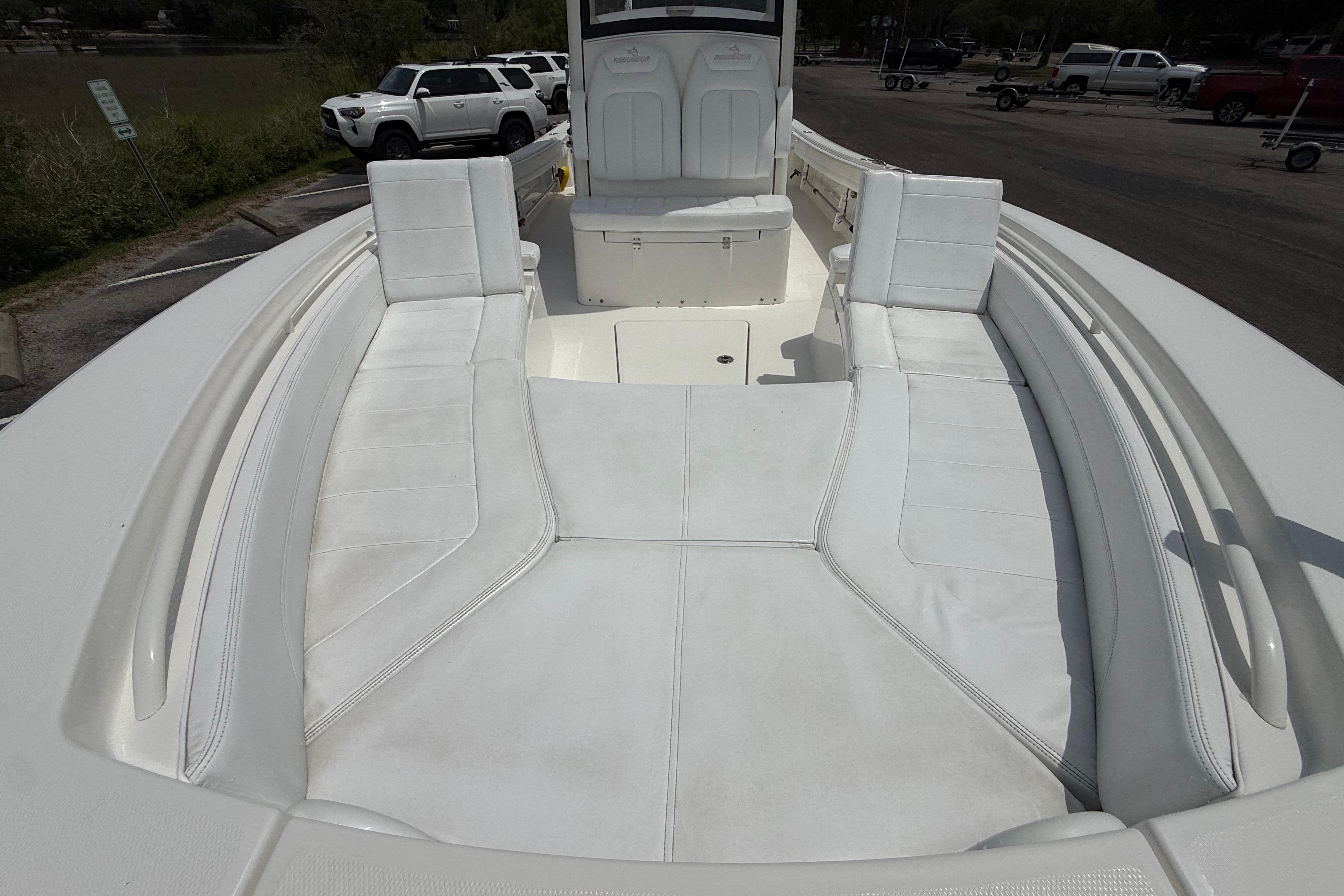2019 Regulator 26XO boat interior with white cushioned seating and spacious deck.