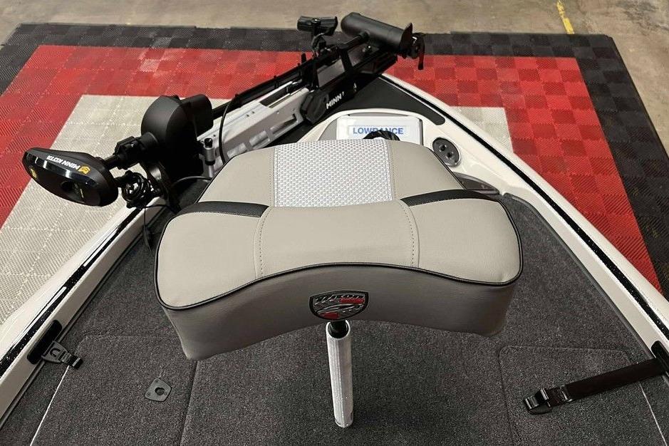 2026 Triton 18 TrX boat interior with seat, trolling motor, and Lowrance electronics.