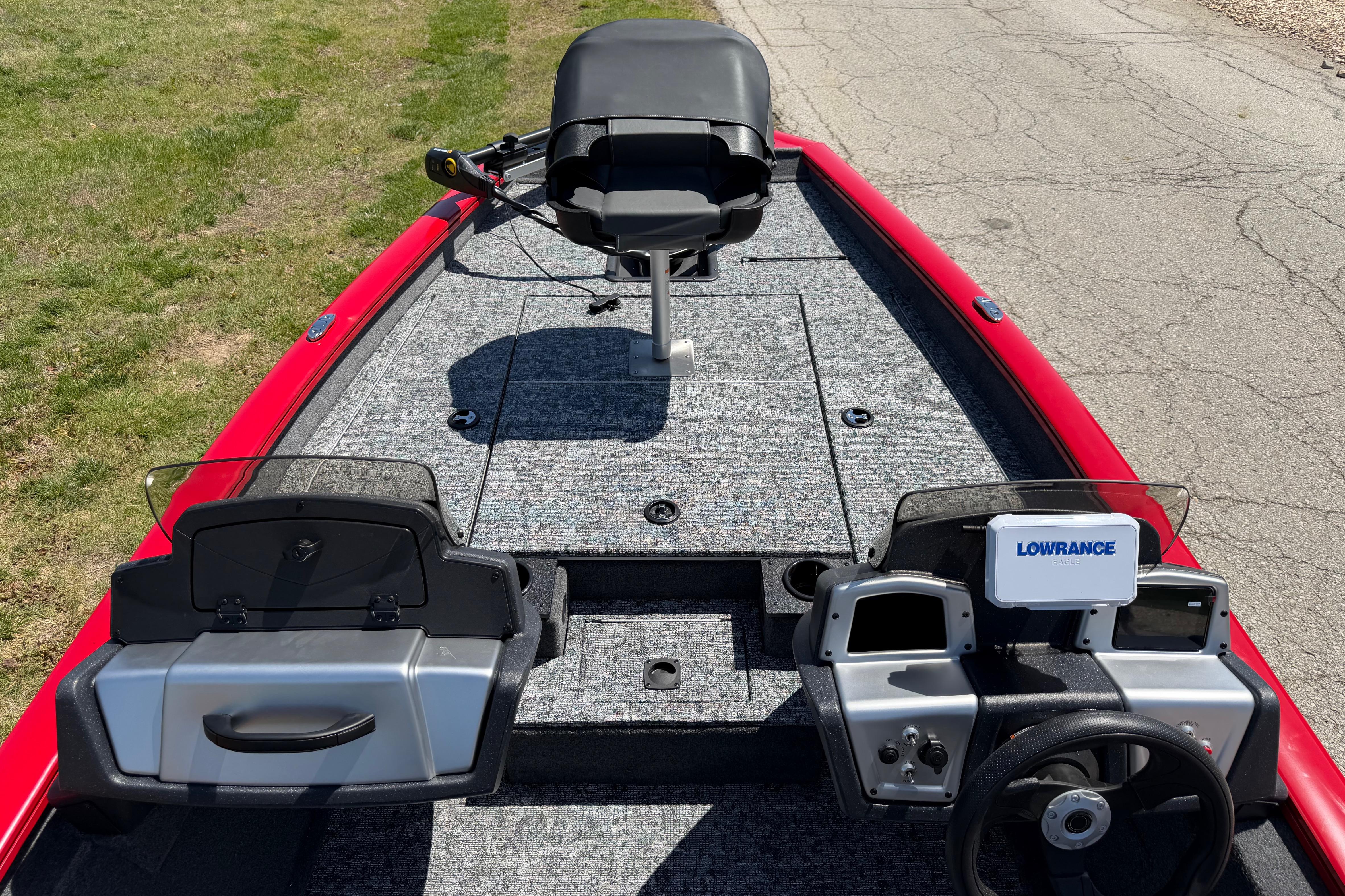 2026 Tracker Pro Team 175 boat interior with steering console and fishing seat.