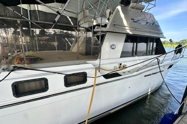 1989 Carver 32 Aft Cabin Motor Yacht docked in a marina.