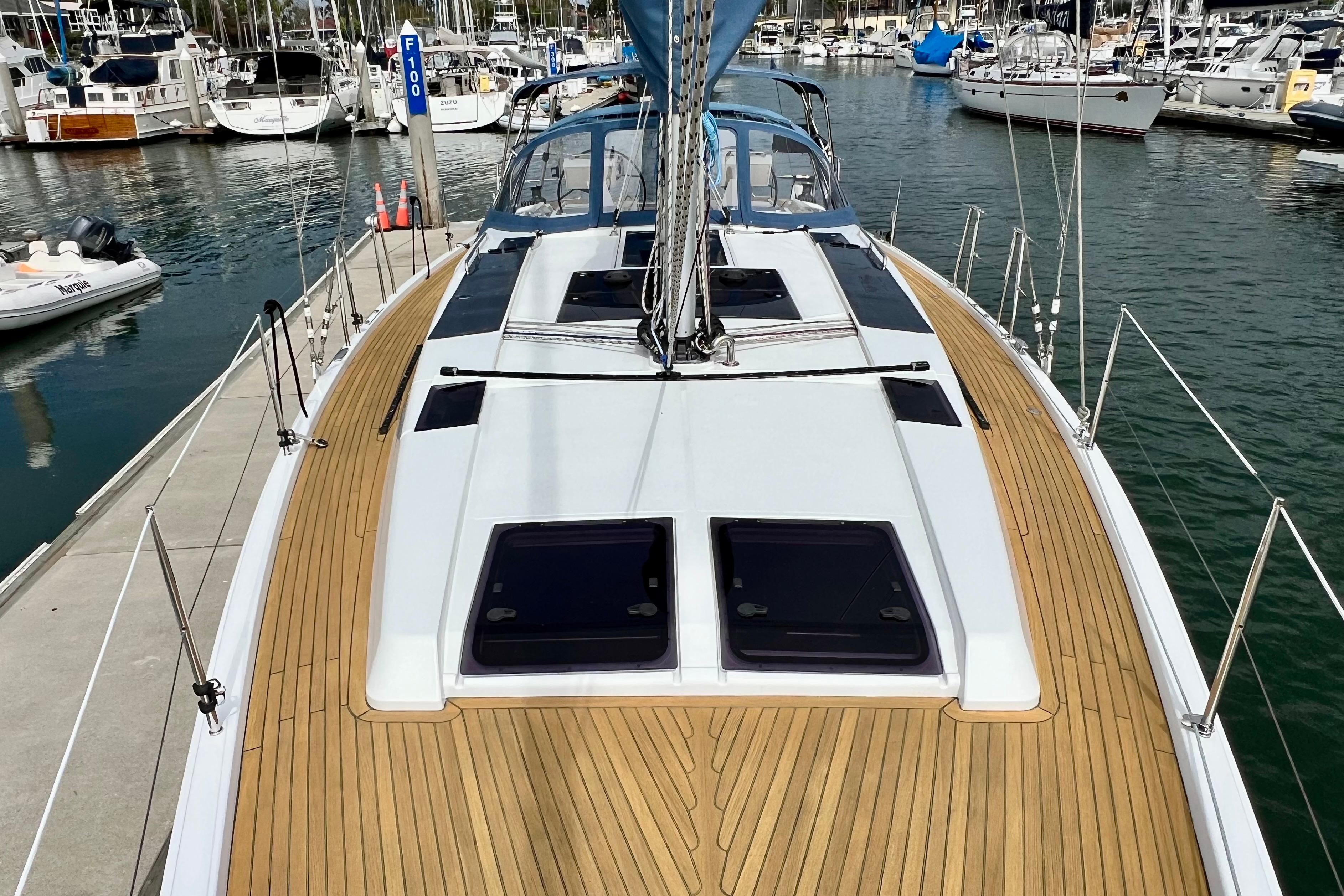 2016 Hanse 455 sailboat docked in marina, featuring sleek deck design and modern fittings.