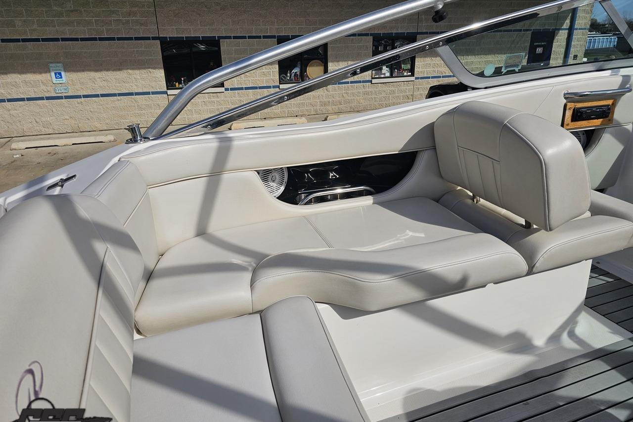 2008 Regal 2520 FasDeck boat interior with white leather seating and sleek design.